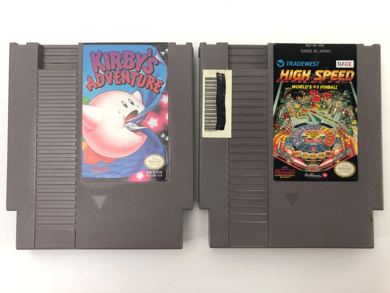 Kirby’s Adventure & High Speed NES Games: 2 NES games including Kirby's Adventure by Nintendo & High Speed by TradeWest. Both cartridges feature labels with some visible wear. Back of cartridges display standard caution information. No boxes