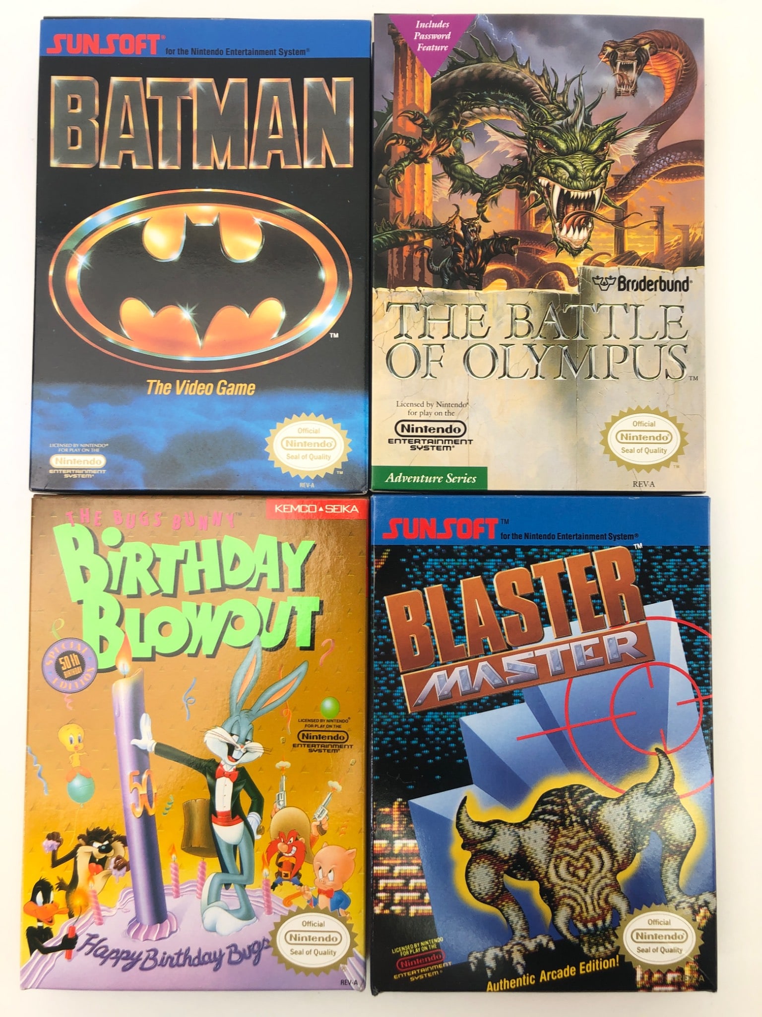 4 NES Games Batman, Blaster Master, Bugs Bunny & Olympus: 4 NES games including Batman by Sunsoft, Blaster Master by Sunsoft, Bugs Bunny Birthday Blowout by Kemco Seika, & The Battle of Olympus by Broderbund. Includes original boxes, cartridges, & manuals. C