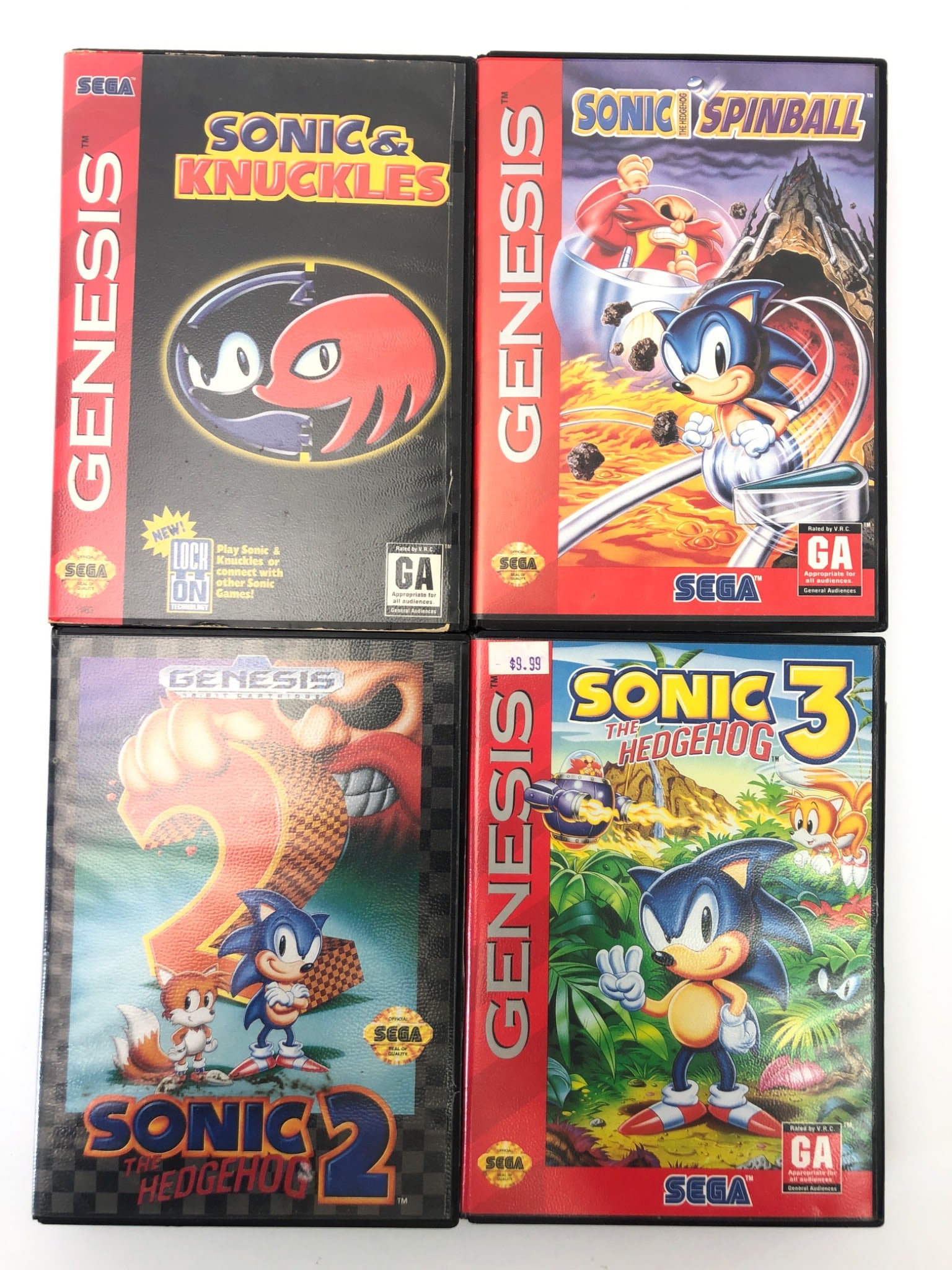 Sonic Sega Genesis Games Lot: Four Sega Genesis video games featuring Sonic the Hedgehog. Includes 'Sonic & Knuckles,' 'Sonic the Hedgehog 2,' 'Sonic the Hedgehog 3,' and 'Sonic Spinball.' Each game comes with its original case an