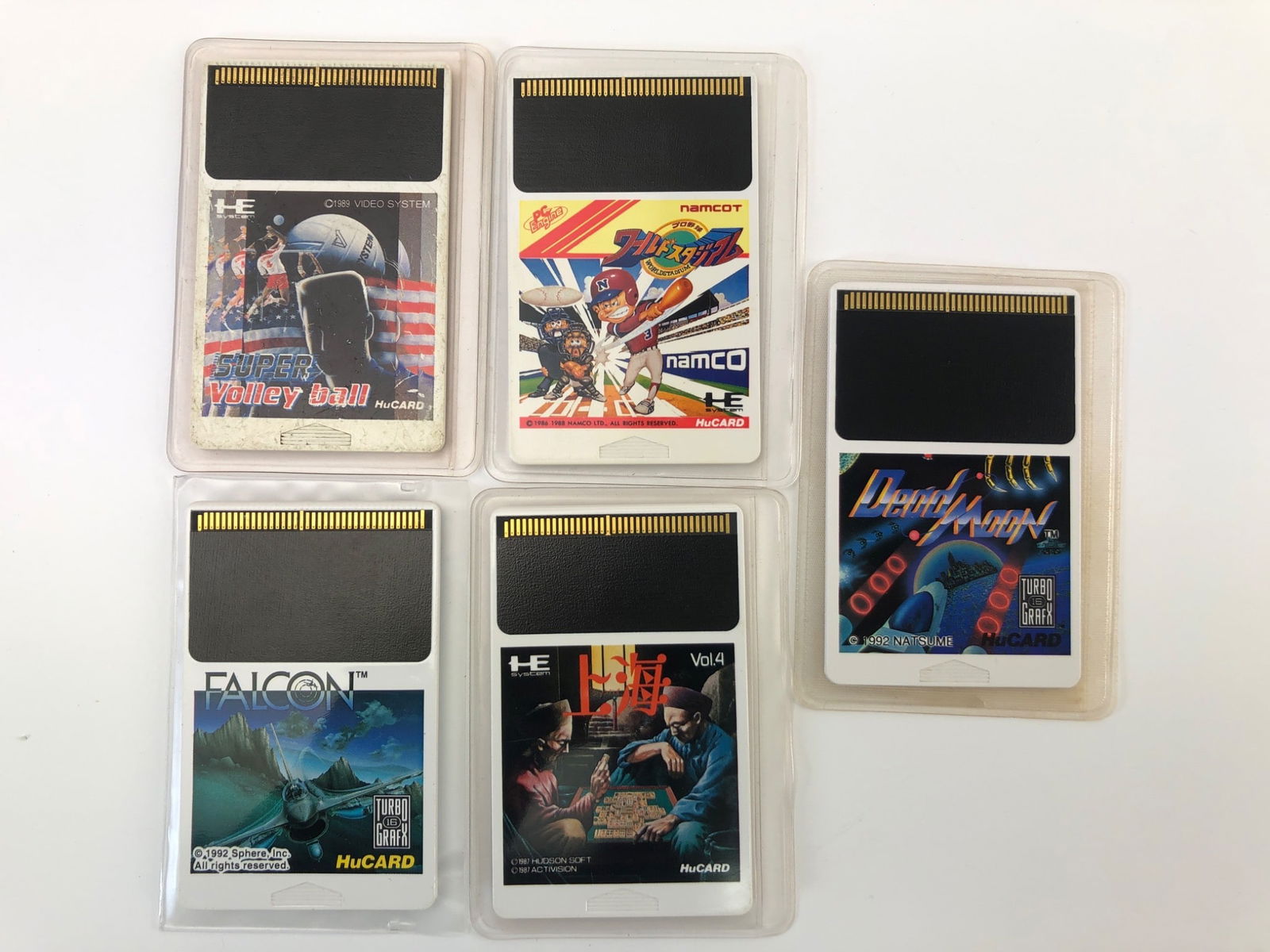 5 TurboGrafx-16 HuCard Games: 5 TurboGrafx-16 HuCard games, including 'Dead Moon', 'Shanghai Vol. 4', 'Falcon', 'Namco Baseball', & 'Super Volleyball'. Each cartridge retains its original plastic casing with detailed instructions