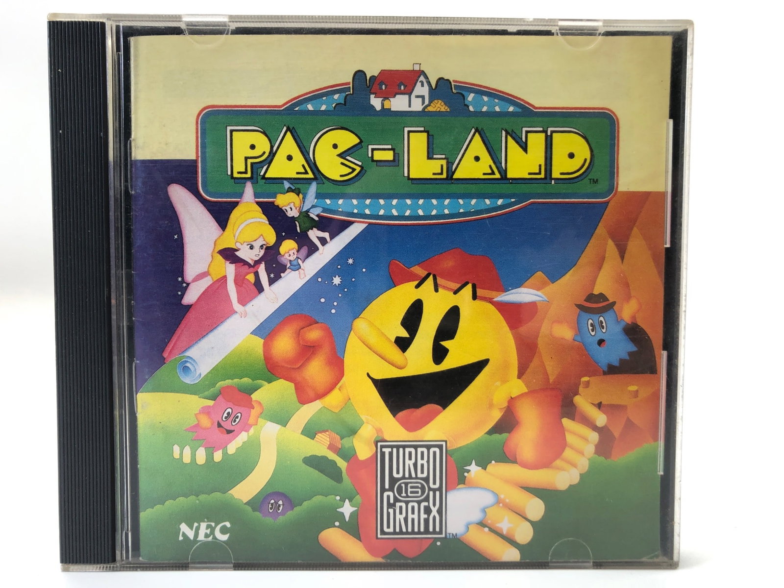 Pac-Land TurboGrafx-16 Game By NEC: Pac-Land video game for TurboGrafx-16 by NEC. Includes HuCard, original jewel case, and instruction booklet. Released in 1984 by Namco Ltd. The game card shows minor wear but remains functional. Made 