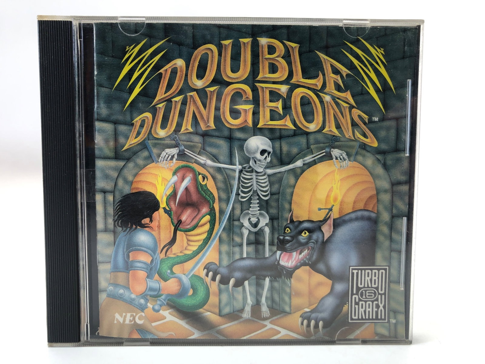 Double Dungeons TurboGrafx-16 Game W/ Case: Double Dungeons game for the TurboGrafx-16 by NEC. Includes original HuCARD, case, and manual. Released in 1990. The case shows light surface wear, and the manual is intact with slight handling marks.