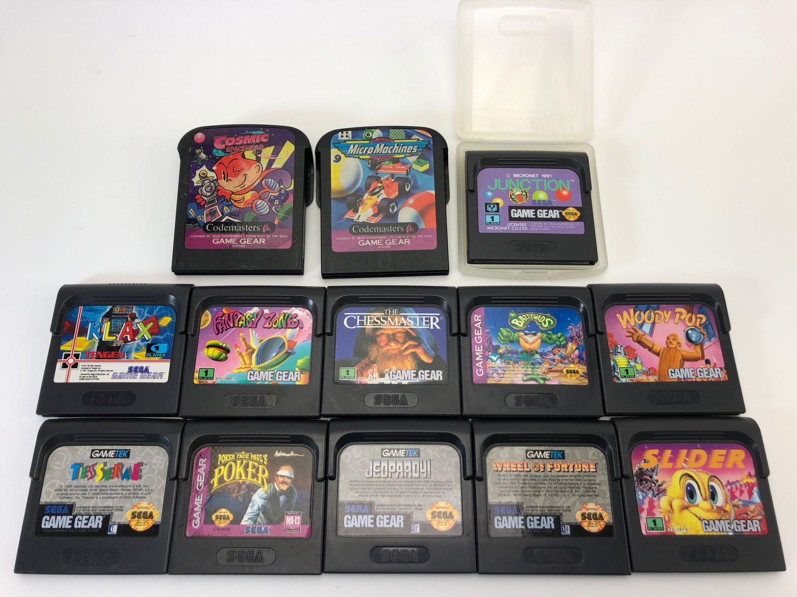 Sega Game Gear Games Lot Of 13: 13 Sega Game Gear game cartridges including titles such as Cool Spot, Jeopardy, Clutch Hitter, Slider & more. Includes plastic protective cases for 1 cartridge. Cartridges show signs of use with minim