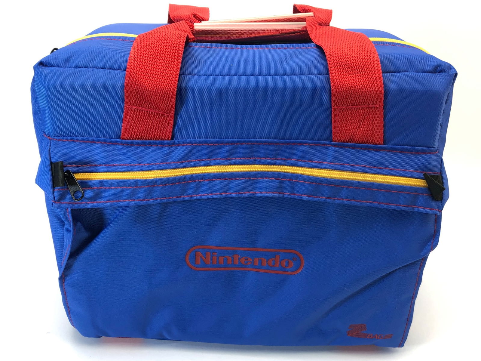 Like New Nintendo Z Bag 12 X 6.5 X 10: Like new Nintendo Z bag featuring blue fabric with red handles & yellow zipper accents. Measures 12 x 6.5 x 10 inches. Spacious interior with red lining & multiple compartments. Ideal for carrying acc