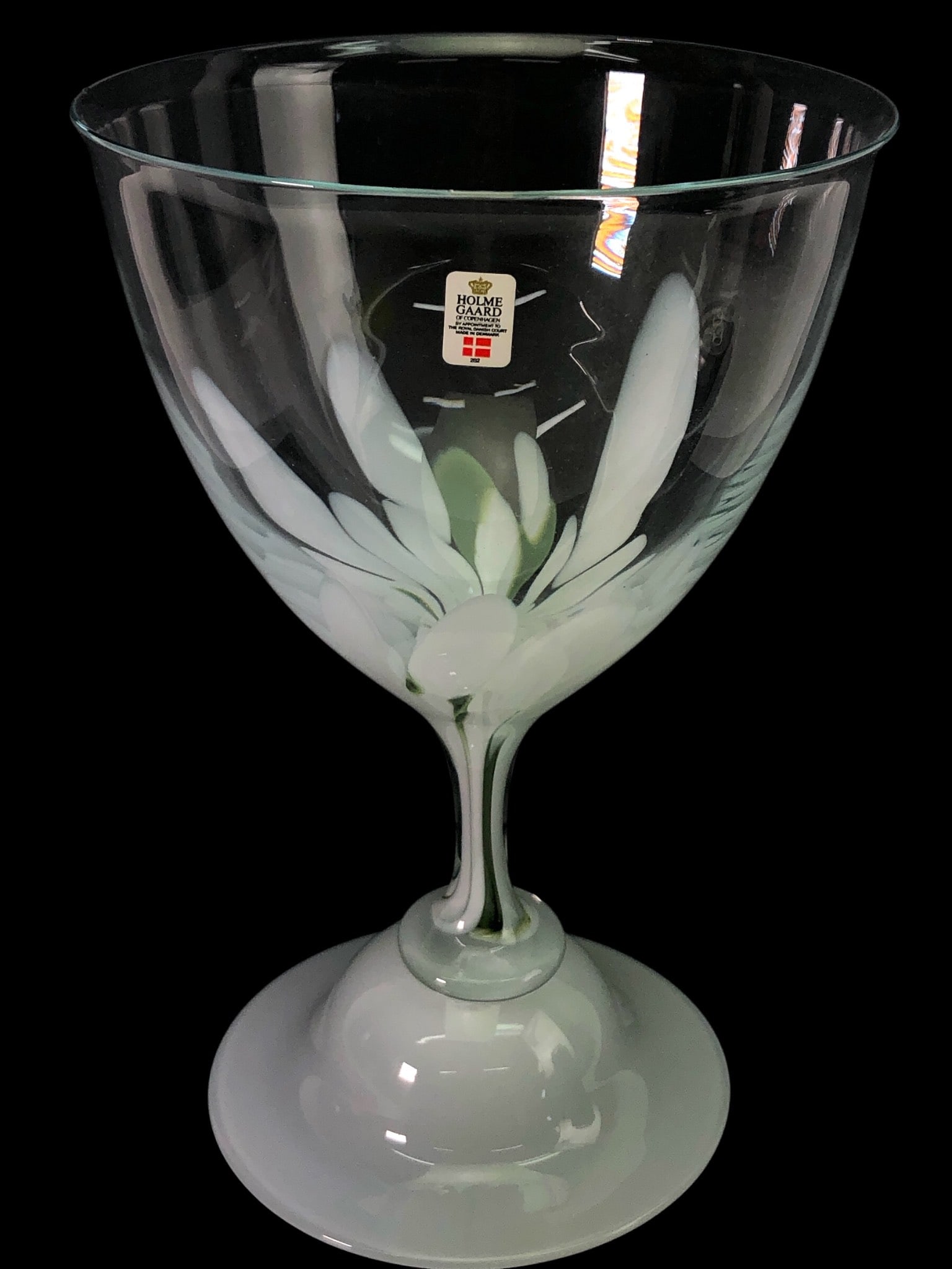 Rare Holmegaard Danish Glass Snowdrop Vase: Rare Holmegaard Danish glass art snowdrop vase featuring a white & green floral pattern. Made in Denmark, marked with Holmegaard label, and dated 1986. Stands 10 7/8 inches tall. Elegant design with a
