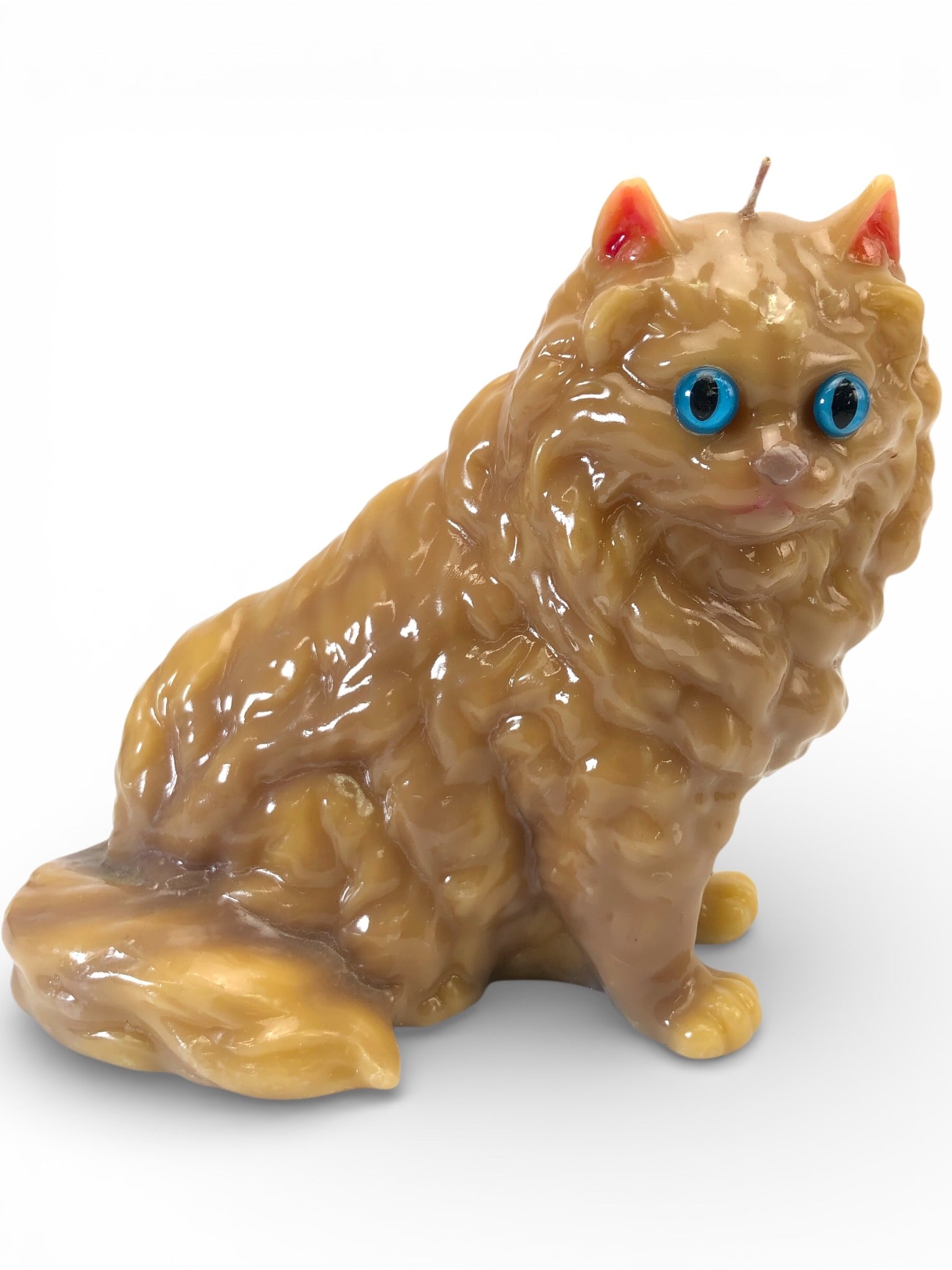 Vtg Persian Cat Candle With Blue Glass Eyes: Vintage Persian cat-shaped wax candle featuring blue glass eyes. Wick has never been lit. Measures 7 inches tall. Detailed design with textured fur and prominent features. Some light surface wear evid