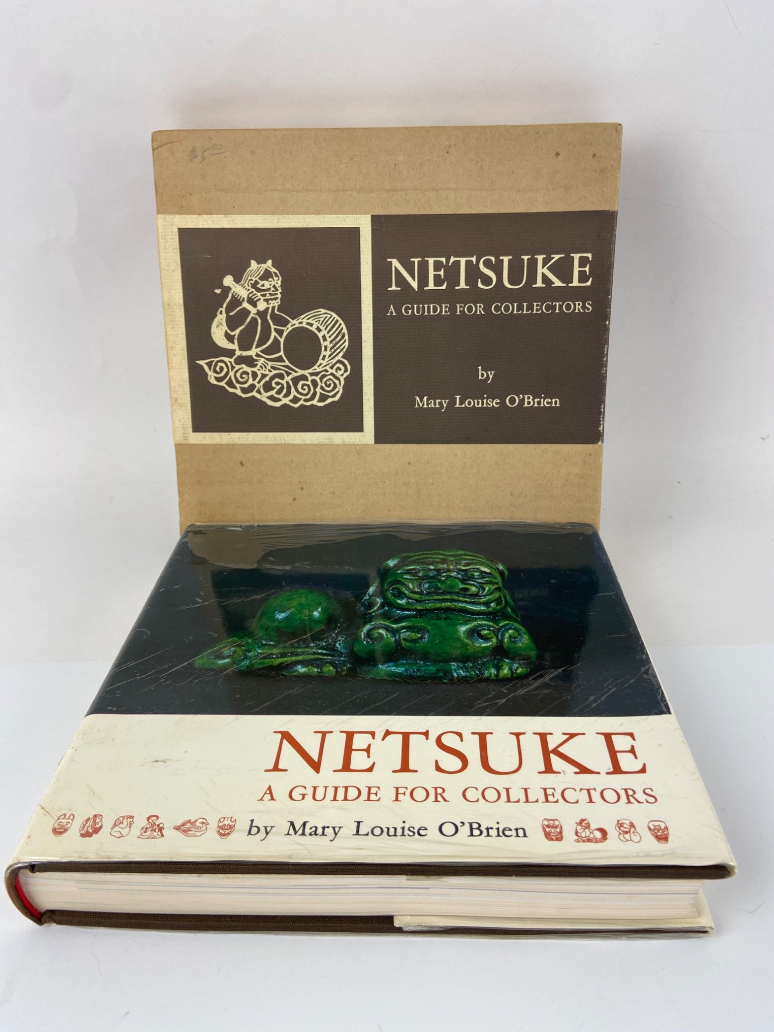 Netsuke Guide For Collectors By O’Brien: First edition hardcover of ‘Netsuke: A Guide For Collectors’ by Mary Louise O’Brien, 1965. Published by Charles E. Tuttle Company, Japan. Comes with a dust jacket & its original slipcase. Includ