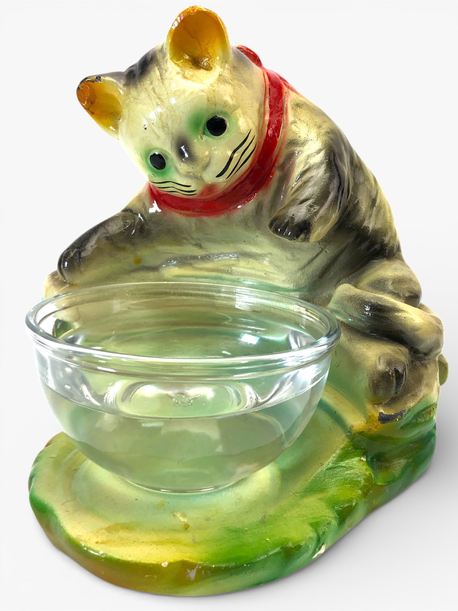 Vtg Chalkware Cat Pawing Fishbowl W/ Anchor Hocking Bowl: Vintage chalkware figure featuring a cat pawing at a fishbowl. Includes a clear glass Anchor Hocking bowl with a 4.75 in. diameter. The cat stands 7.5 in. tall. There are visible cracks & chips on the
