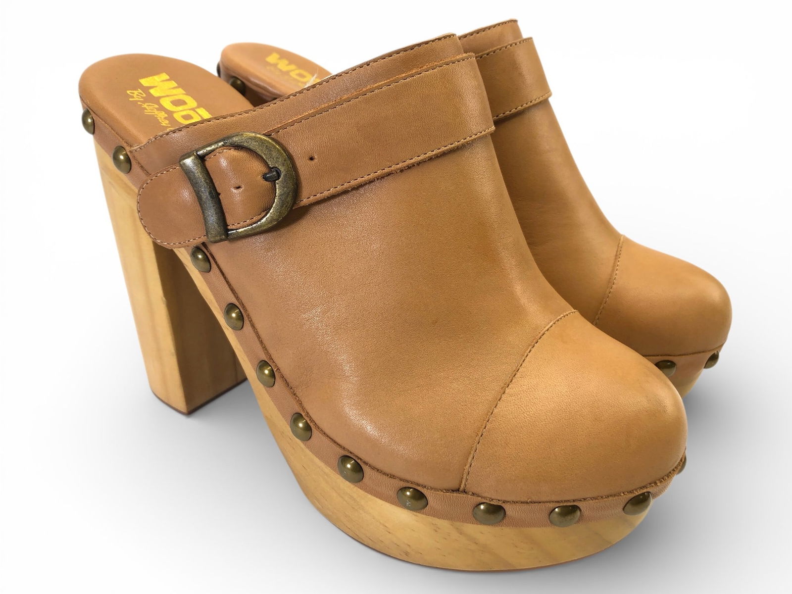 Woodies By Jeffrey Campbell Charli-C High Clog: Woodies by Jeffrey Campbell Charli-C high clog sandals featuring a leather upper, man-made sole, & brass-tone stud accents. Made in China, size 6M. Noticeable wear on the lining & some scuffs on the w