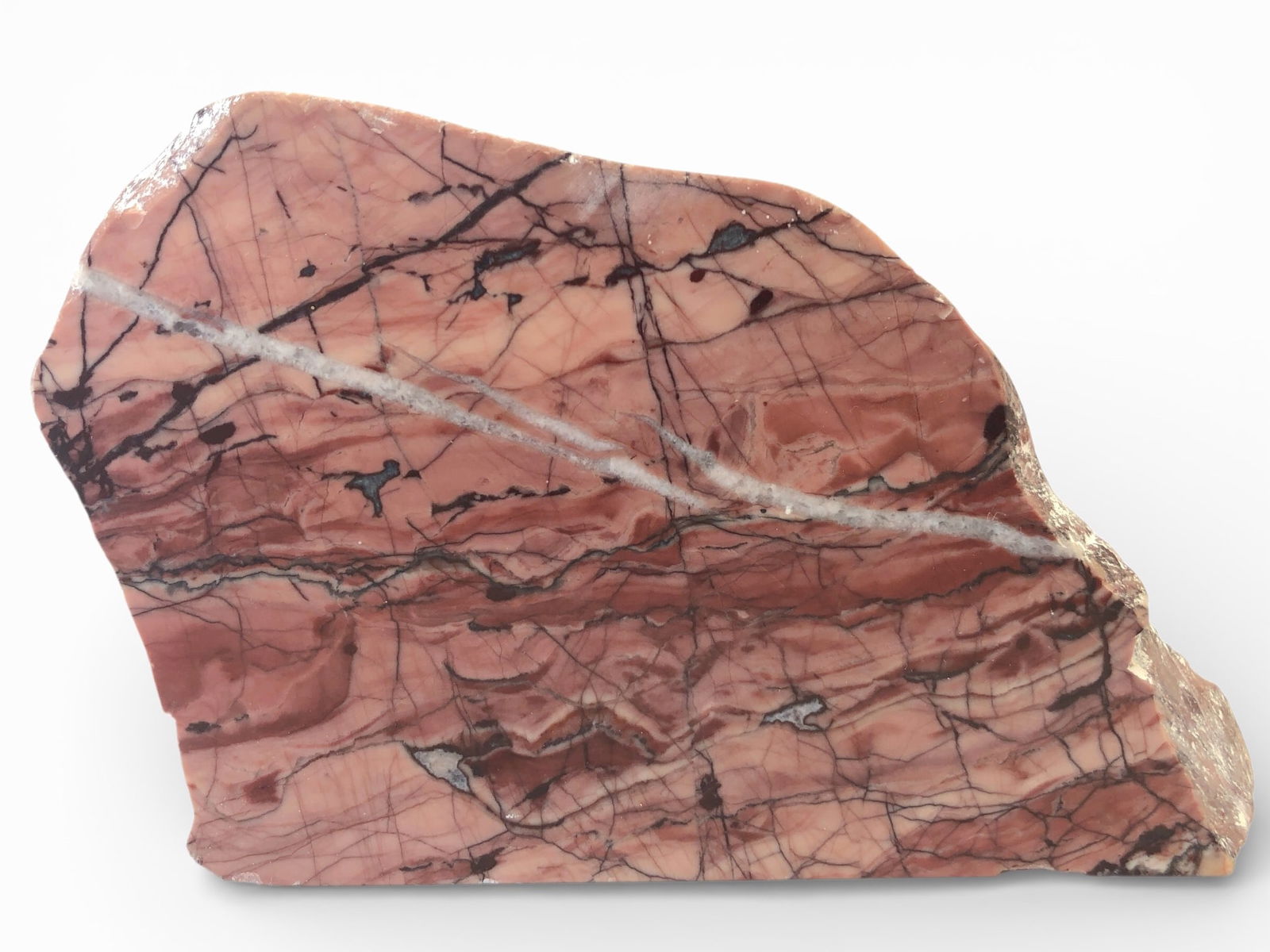 Kuna Dolomite Slab With Pink & Red Patterns: Kuna dolomite slab measuring 5.5 inches tall, formed over 2 billion years ago & found almost exclusively in Michigan's Upper Peninsula. Known for its striking pink & red banded patterns with