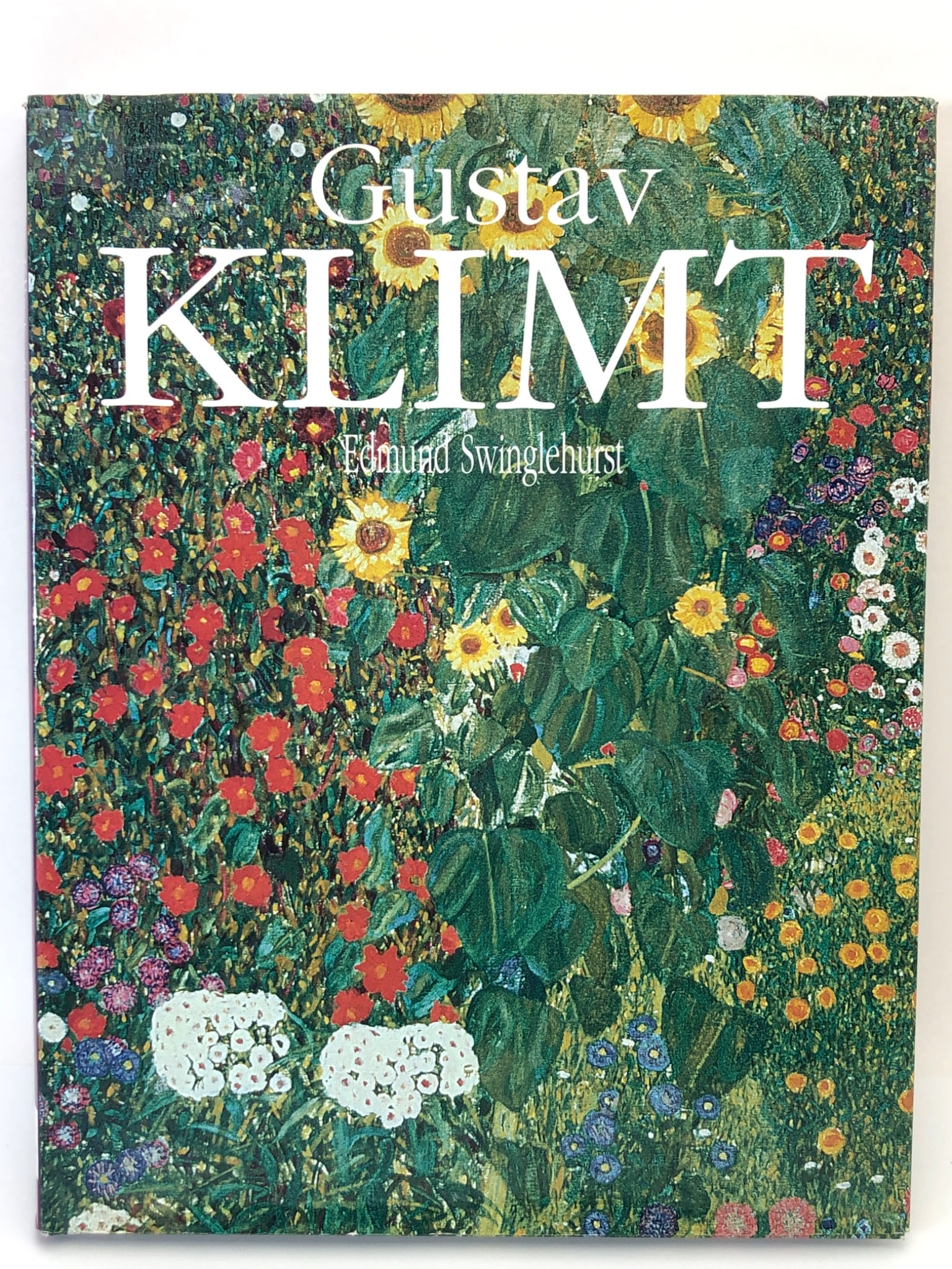 Gustav Klimt By Edmund Swinglehurst: 2001 first edition hardcover by Edmund Swinglehurst on the works of Gustav Klimt, with a dust jacket. Includes text and color reproductions of Klimt's art. There is noticeable wear and a tear on the d