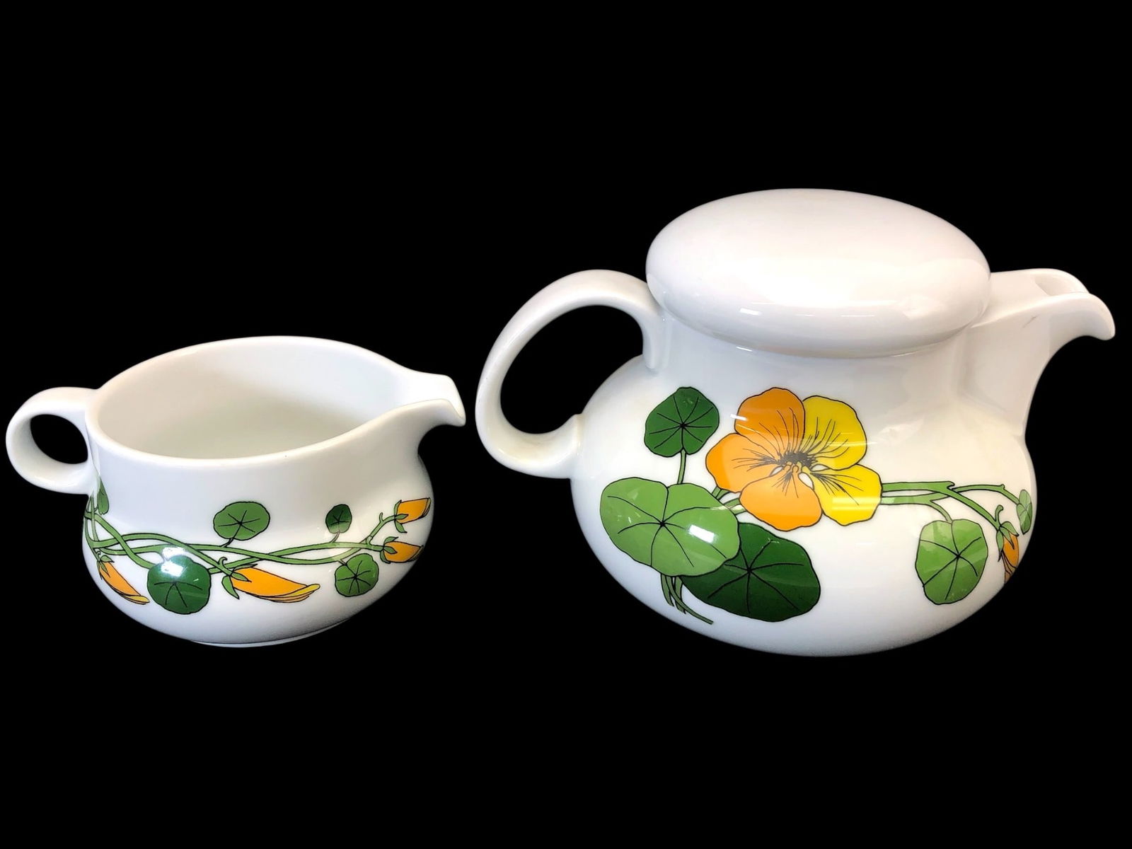Vtg Thomas Rosenthal Nasturtium Tea Pot & Creamer: Vintage Thomas Rosenthal porcelain tea pot & creamer set featuring a vibrant nasturtium floral design. The tea pot stands 5 inches tall to the top of the lid. Stamped 'Thomas Germany' & marked 'The