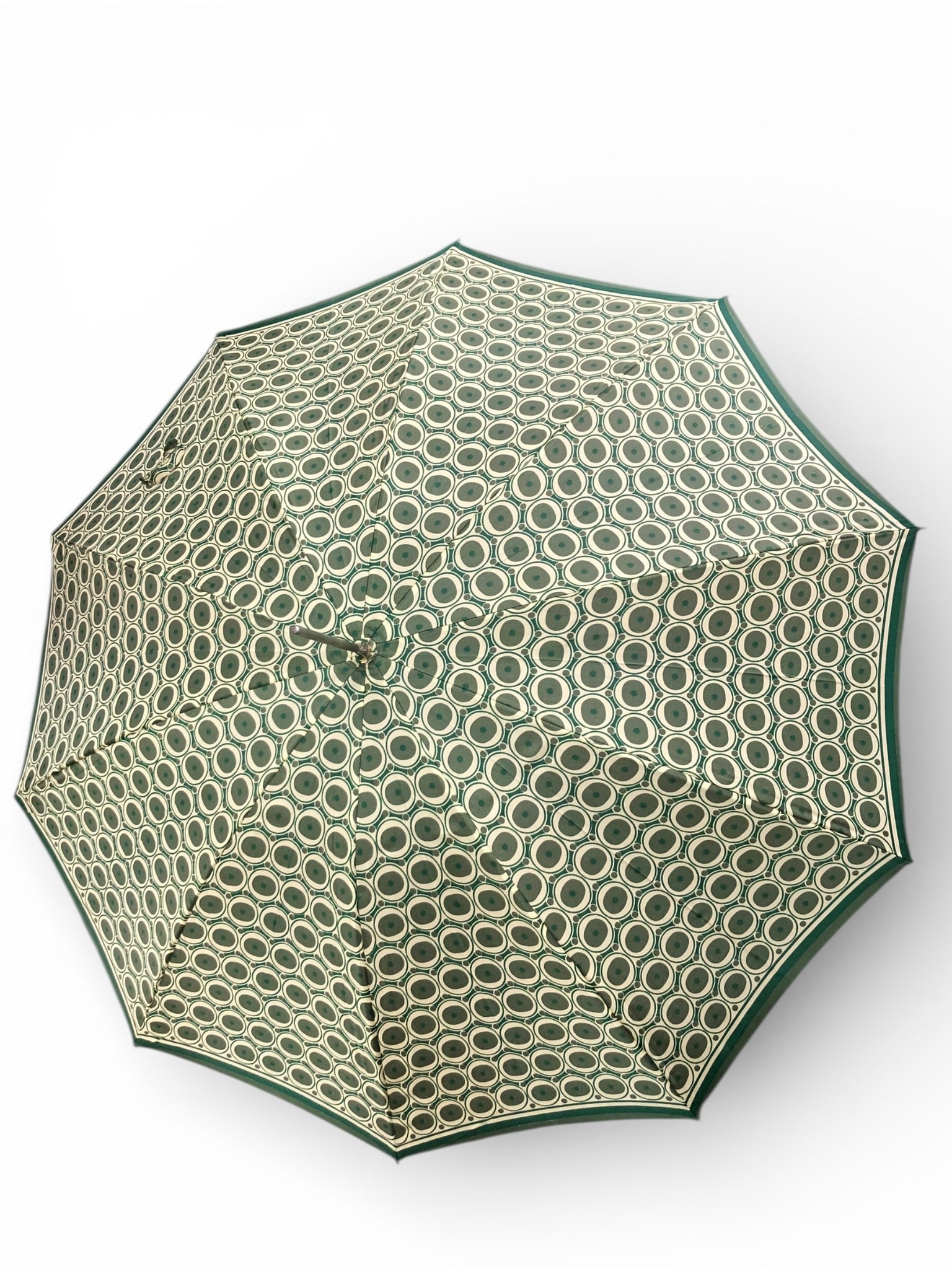 Vtg 10 Spoke Umbrella With Decorative Handle: Vintage umbrella featuring a 10-spoke frame, approximately 35 inches long, with a patterned green canopy and a decorative sculpted brass-tone handle. The fabric features a green & white circular