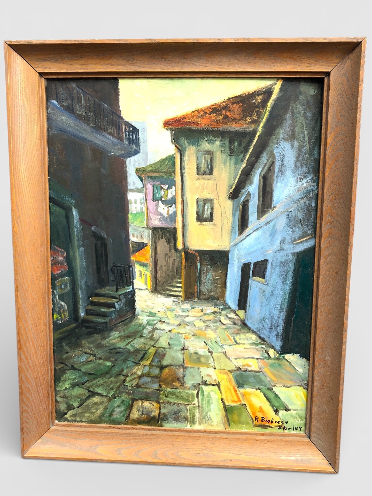 MCM R Bicknese Stanley 1961 European Street Scene: Original mid-century modern painting by R. Bicknese Stanley titled 'European Street Scene', March 1961. Painted on canvas board with a signed Morilla Company stamp on the back. Vibrant street scene de