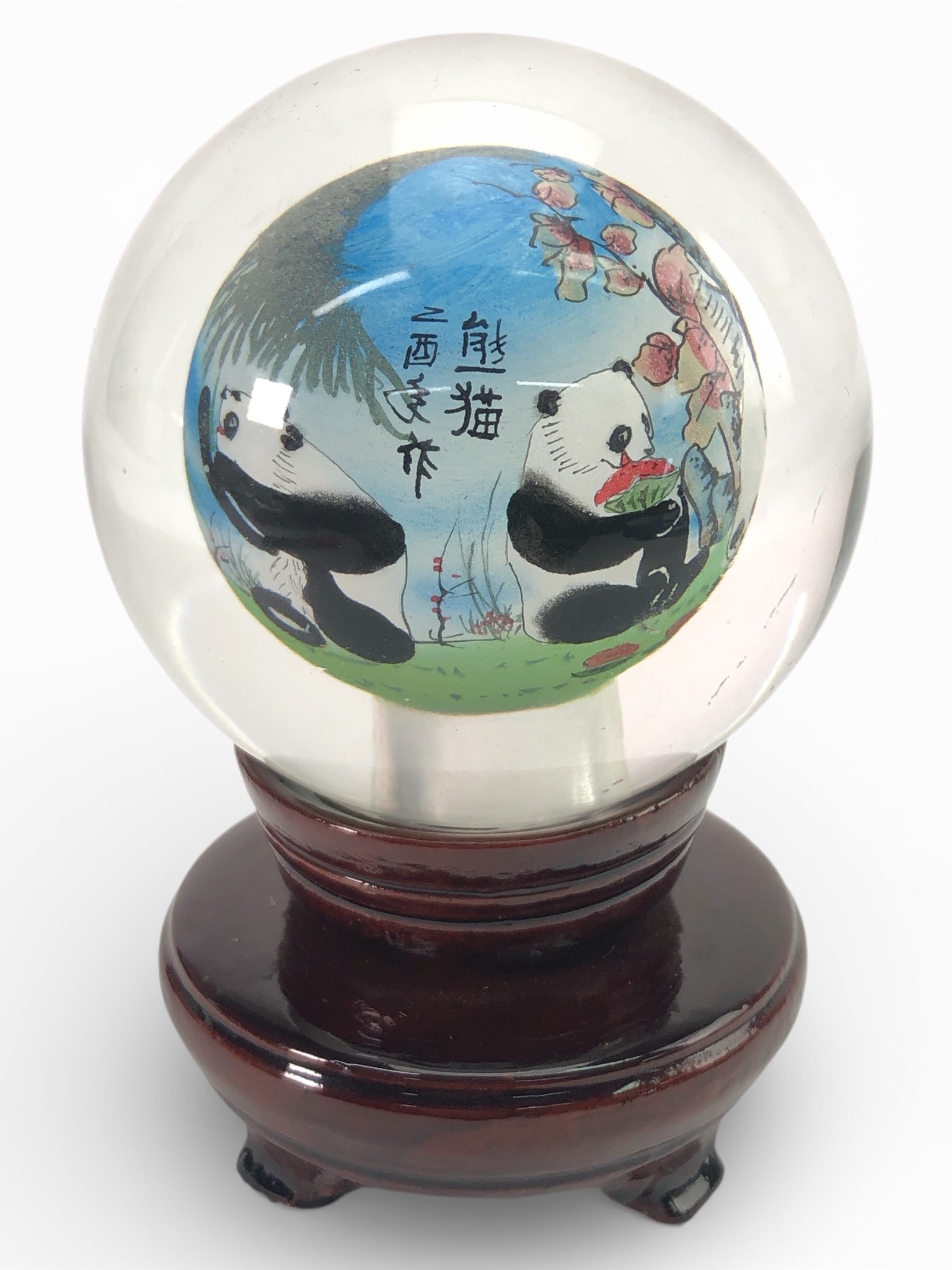 Reverse Painted Panda Glass Globe & Wood Base: Reverse painted oriental panda design on a glass globe. The globe stands 5 inches tall when placed on its wooden base, which features a dark finish and removable construction. Includes two pieces: