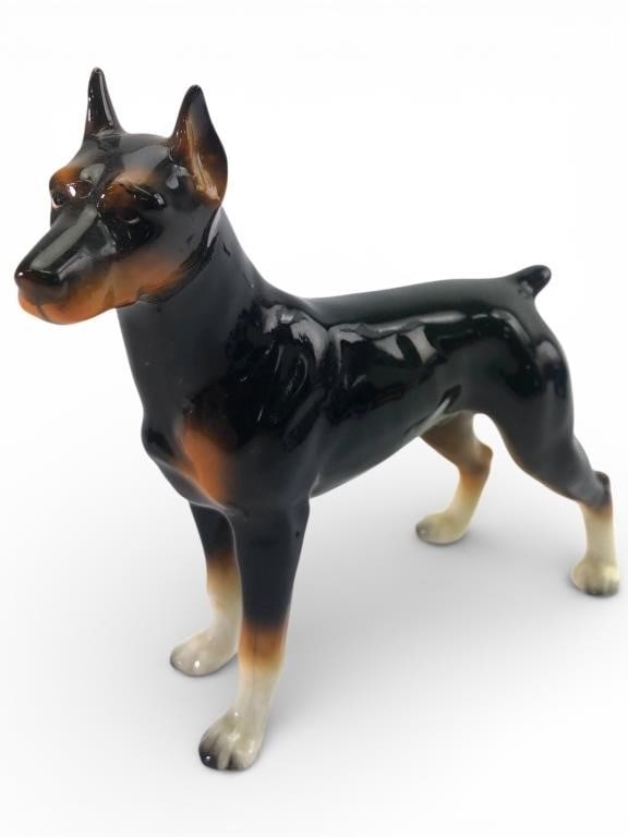 Lefton Doberman Pinscher Porcelain Figurine: Lefton Doberman Pinscher figurine crafted from porcelain, made in Japan. Features black, brown, & white coloring with a glossy finish. Includes original Lefton sticker on the underside. Measures 5.5 i