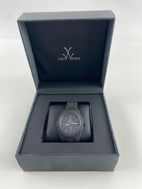 Toywatch Velvety Black Dial Watch In Box: Toywatch velvety black dial watch, model IW04BK, featuring black case & strap with purple hour markers. Comes in original box & includes hang tag. Stylish design, suitable for casual or formal occasio