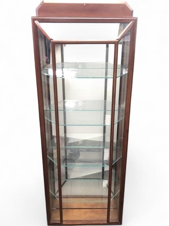 MCM Wood and Glass Wall-Mount Curio Cabinet: Mid-Century Modern style wall-mounted curio display cabinet featuring a wood frame with a mirrored back and four removable glass shelves. The cabinet has a single hinged glass door with decorative bra