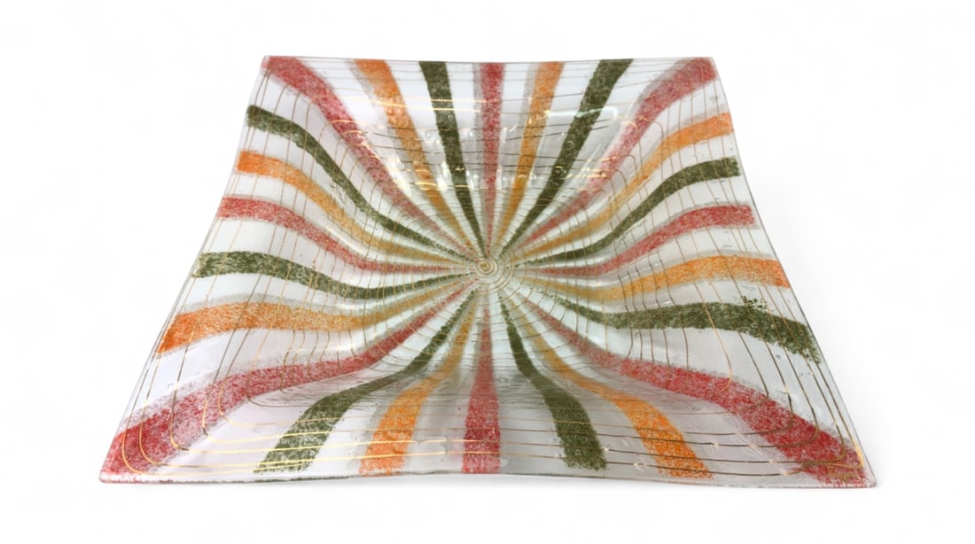 MCM Higgins Fused Art Glass Bowl: Mid-Century Modern fused art glass bowl by Higgins. Features a square form with a vibrant sunburst or starburst pattern in red, orange, and green textured glass powders, accented by gold-tone concentr