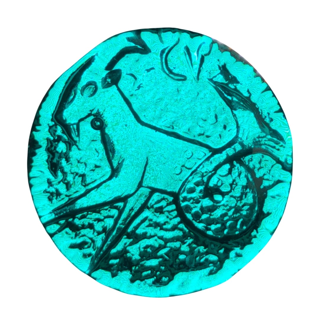 VTG Blenko Azure Blue Glass Capricorn Zodiac Paperweight: Vintage Blenko art glass paperweight in azure blue. This hand-blown piece features a pressed design depicting the Capricorn zodiac sign. The underside shows a textured, pebbled finish from the pressin