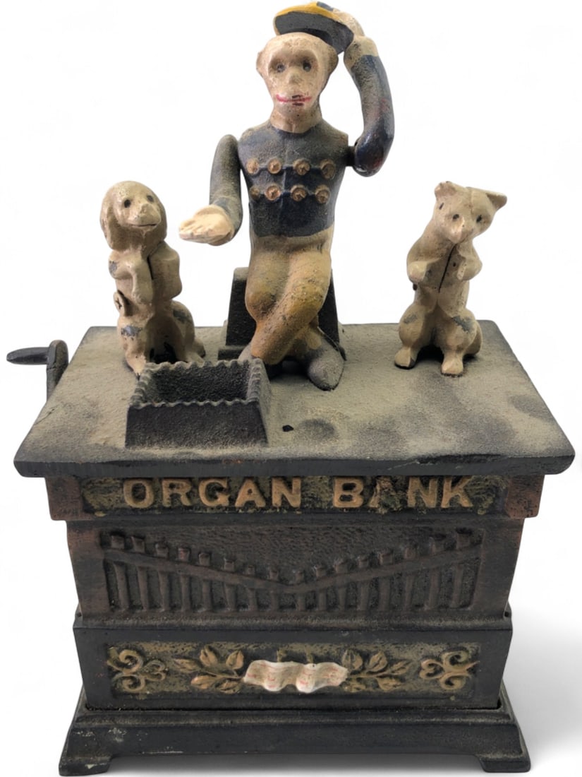 Antique Cast Iron Mechanical Organ Bank: Antique cast iron mechanical coin bank. Maker unknown. Depicts an organ grinder monkey with a dog and a cat. Features a side crank mechanism for coin deposit. Marked 'ORGAN BANK' on front. Shows wear,