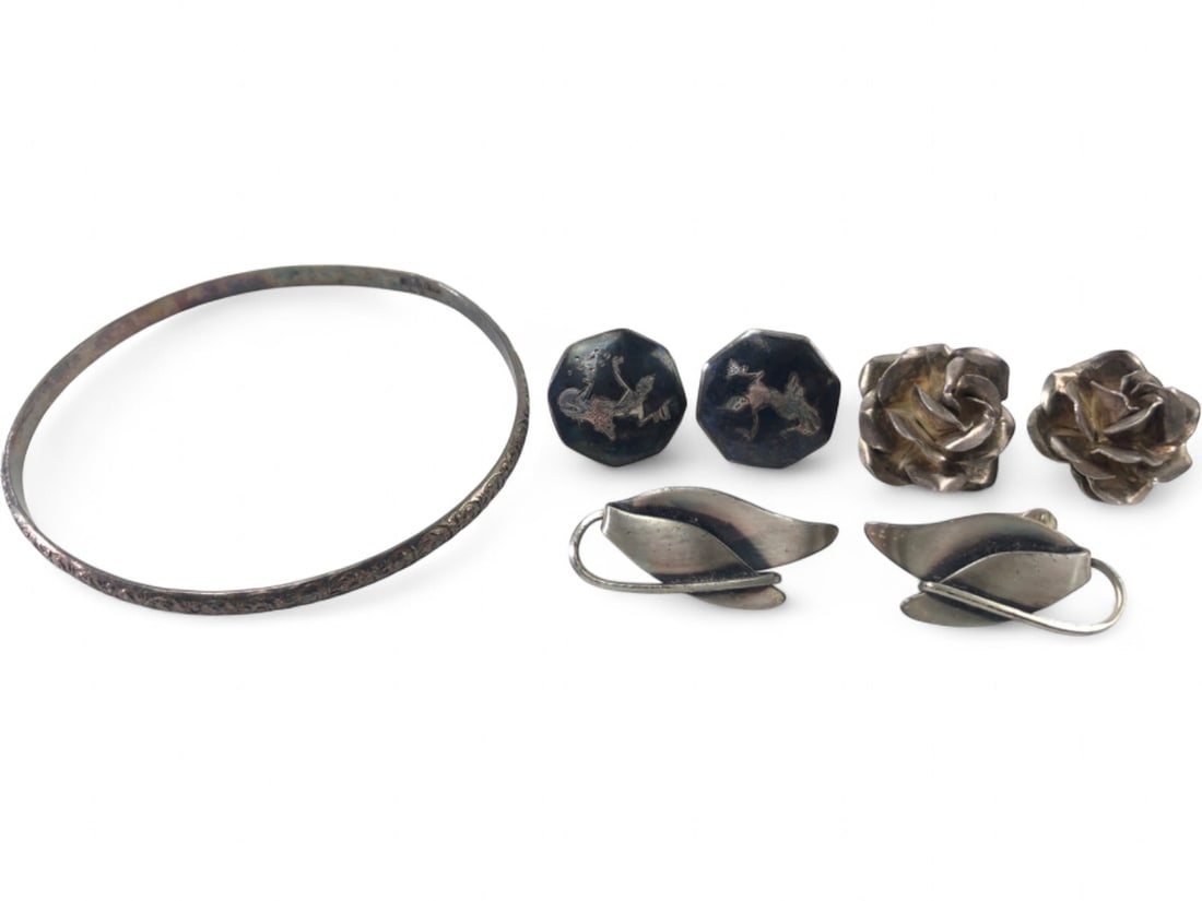 Sterling Silver Jewelry Lot with Mexican Earrings: A 7 piece sterling silver jewelry lot. Includes a pair of Mexican sterling silver rose-form clip-on earrings marked 'Mexico 925' with a maker's mark 'EF' in a circle; a pair of Coro sterling silver le
