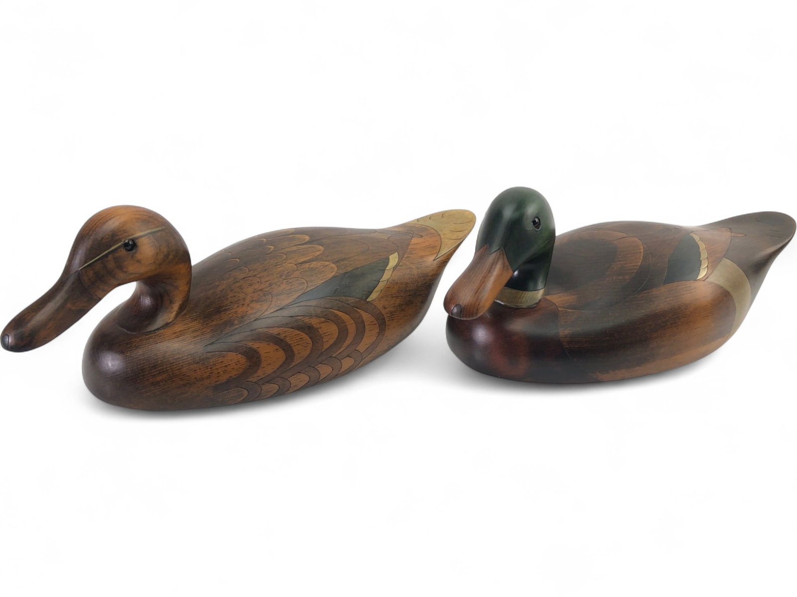 VTG John Jeffrey Barto Signed Mallard Decoys, Pr.: Pair of vintage hand-carved and segmented wooden mallard decoys by John Jeffrey Barto, dated 1984. Includes one drake with a green-stained head and one hen. Both feature intricate inlaid wood patterns