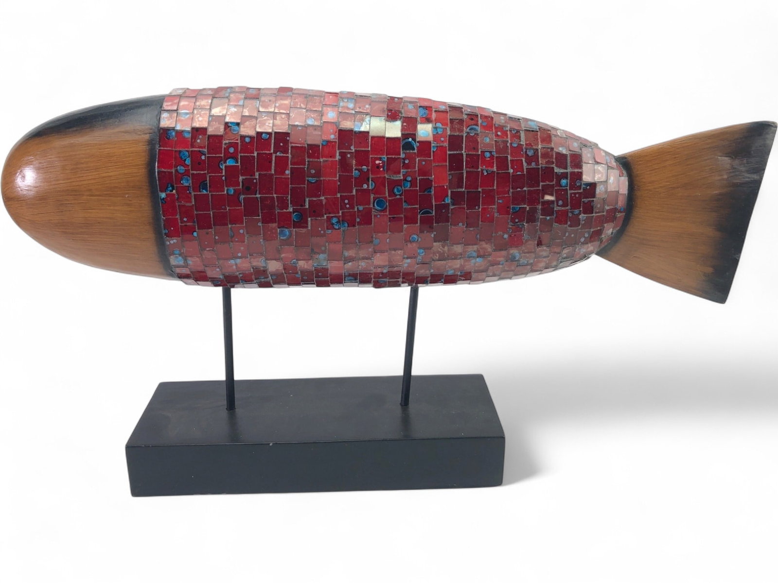 Mosaic Glass Tile and Faux Wood Fish Sculpture: A contemporary fish sculpture featuring a central body covered in a mosaic of red glass tiles with blue and white circular accents. The head and tail are crafted to resemble faux wood with dark staine