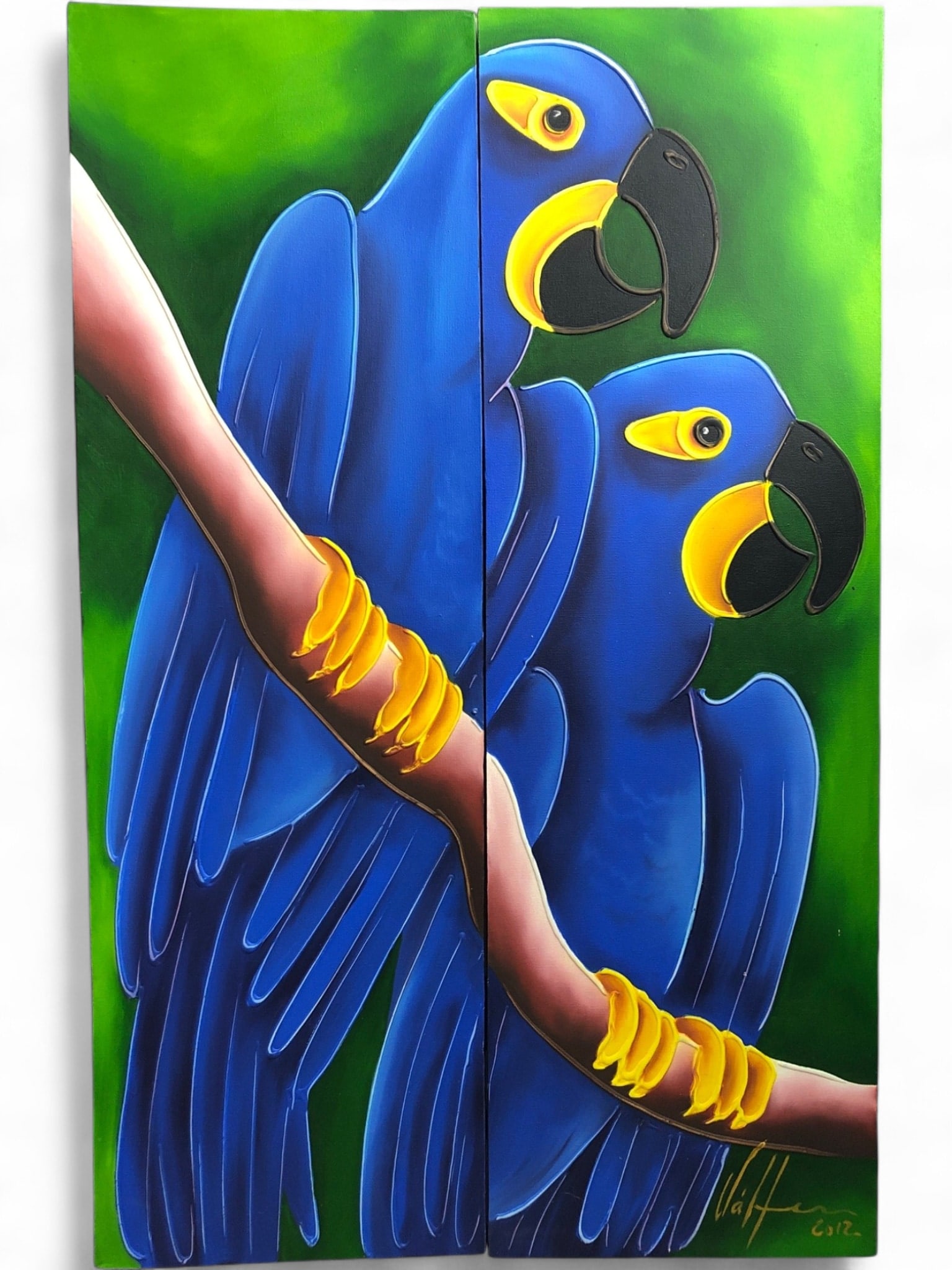 Signed Hyacinth Macaw Oil on Canvas Diptych: A vibrant diptych oil painting on canvas depicting two Hyacinth Macaws perched on a branch. The artwork features heavy impasto texture on the yellow facial markings and feet. Signed and dated 2012 in 