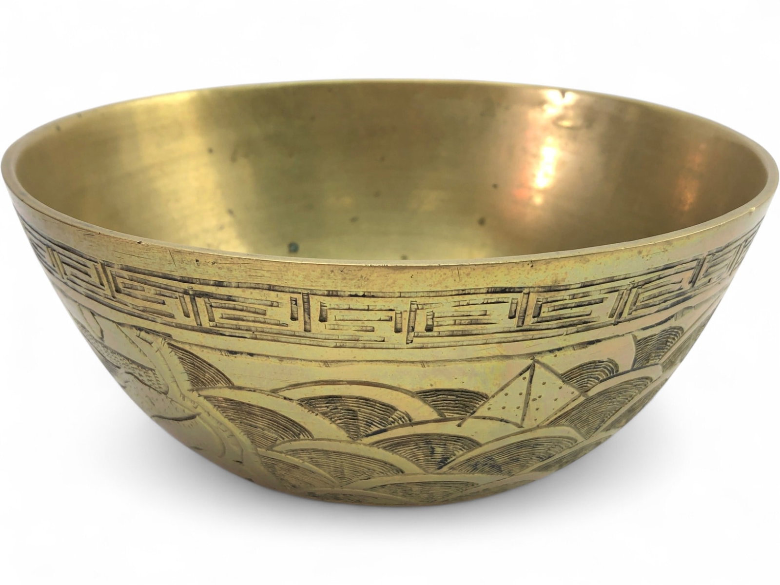 Chinese Etched Brass Dragon Bowl: Chinese brass bowl featuring an etched dragon and wave motif with a Greek key border. The underside bears a cast six-character Xuande mark and a stamped "MADE IN CHINA" mark. Interior shows heavy