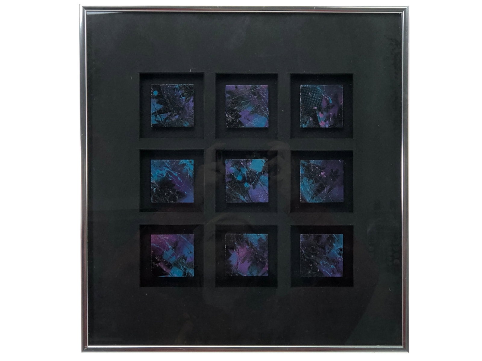 Alice Palmer Signed Abstract Mixed Media Artwork: Framed abstract mixed media artwork by Alice Palmer, dated 1994. The piece features a grid of nine individual square compositions with textured surfaces in shades of purple, blue, and black. Housed in