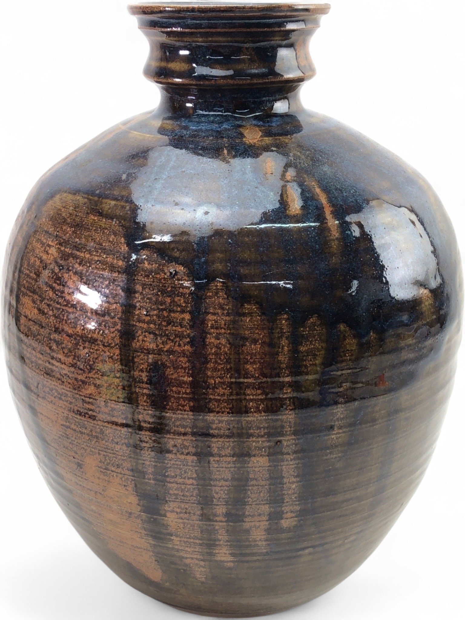 Jim Castiglione Michigan Studio Pottery Vase: Large stoneware studio pottery vase by Michigan artist Jim Castiglione. The vessel features a bulbous body with a flared, multi-tiered rim and a rich, variegated brown and blue-black drip glaze over a