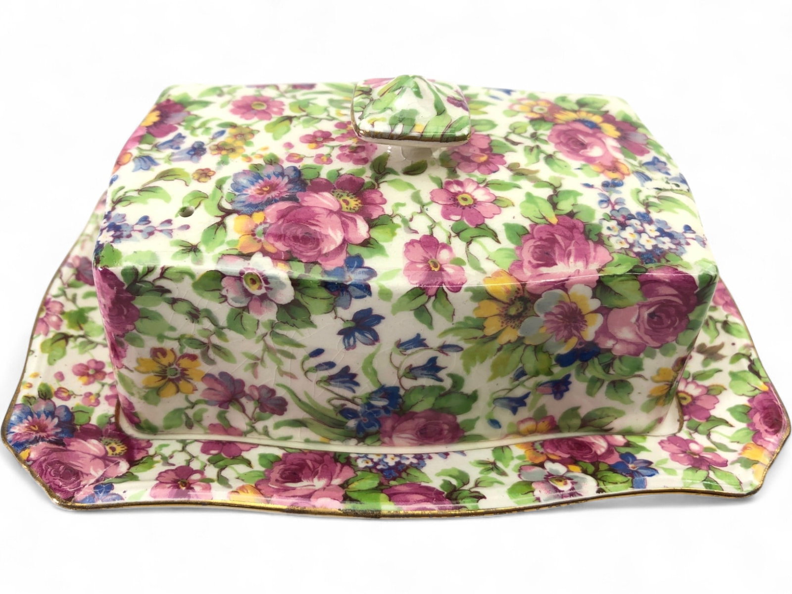 Rare Royal Winton Summertime Chintz Cheese Dish: A rare Royal Winton Grimwades porcelain covered cheese dish in the 'Summertime' chintz pattern. This rectangular dish features a vibrant all-over floral motif with gilt-edged rims. Marked on the under