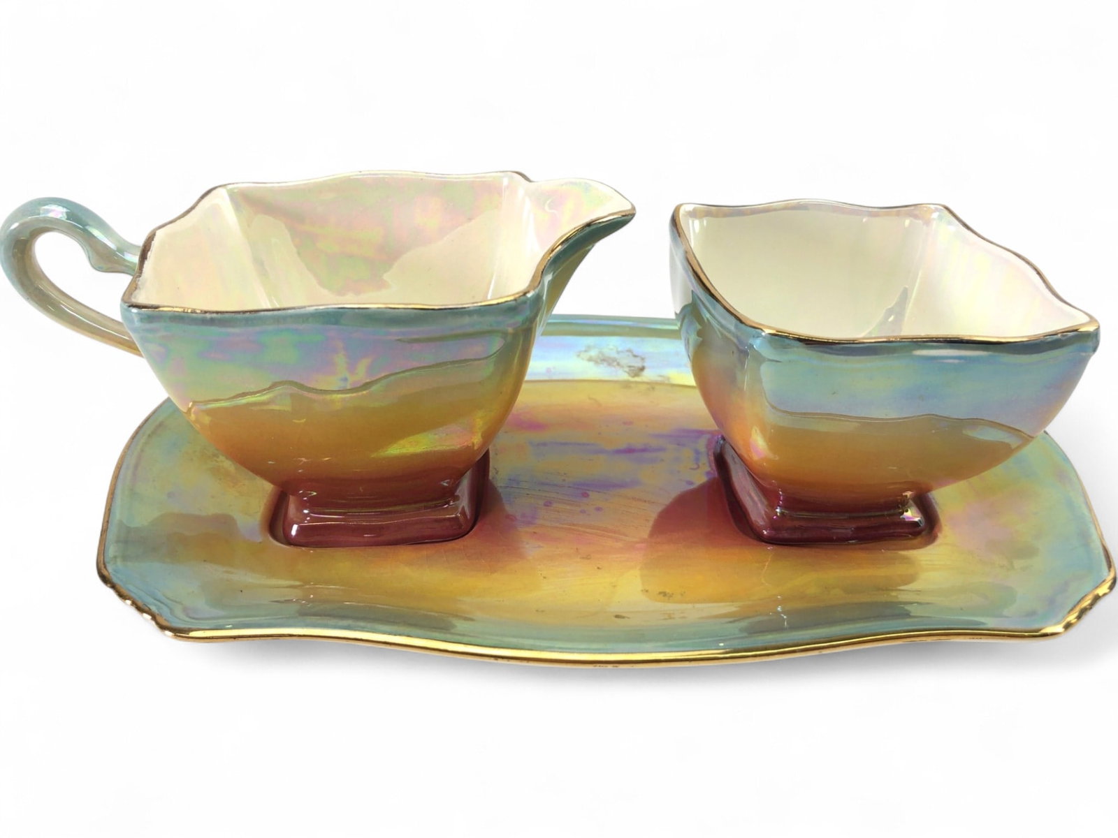 VTG Royal Winton Grimwades Rainbow Lusterware Set: Vintage Royal Winton Grimwades porcelain tea service set featuring a vibrant rainbow iridescent luster glaze with gold-tone rim accents. The set includes a creamer, an open sugar bowl, and a matching 