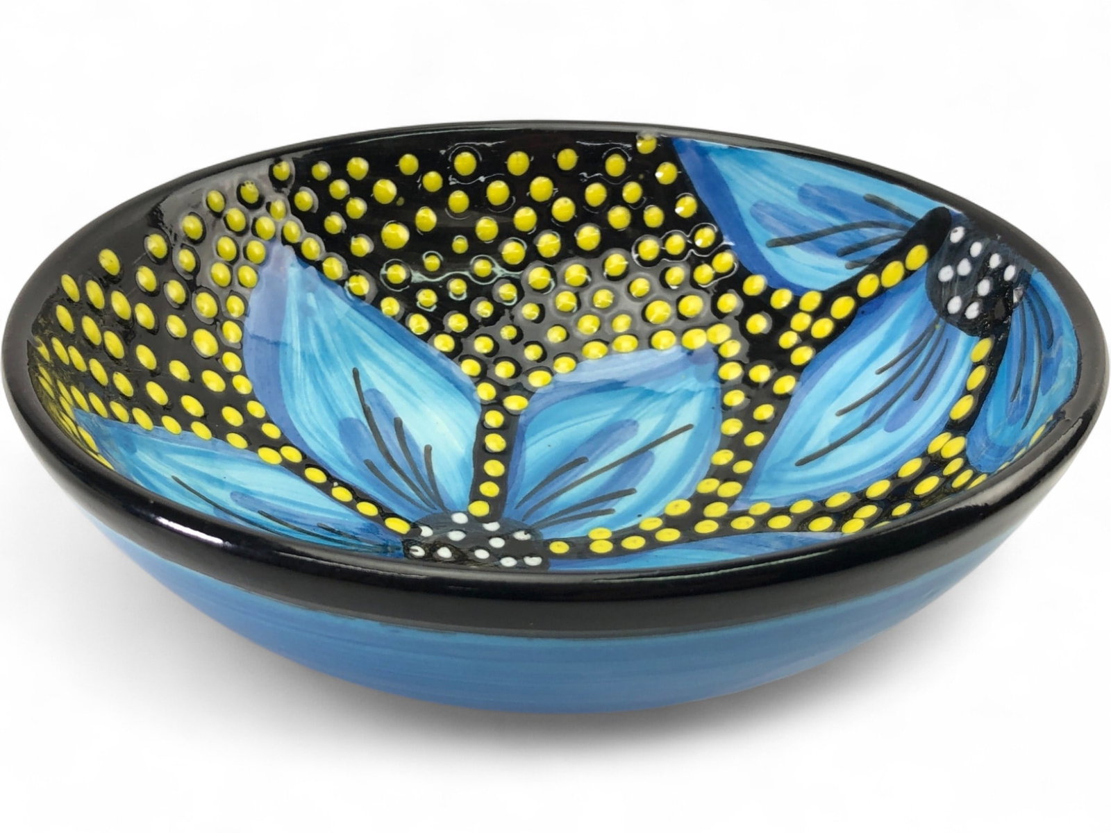 Ivanros Hand Painted Ceramic Bowl, Spain: Decorative hand-painted ceramic bowl by Ivanros. Features a vibrant blue floral motif against a black ground with yellow dot accents. The exterior is finished in a blue-streaked glaze. Marked on the