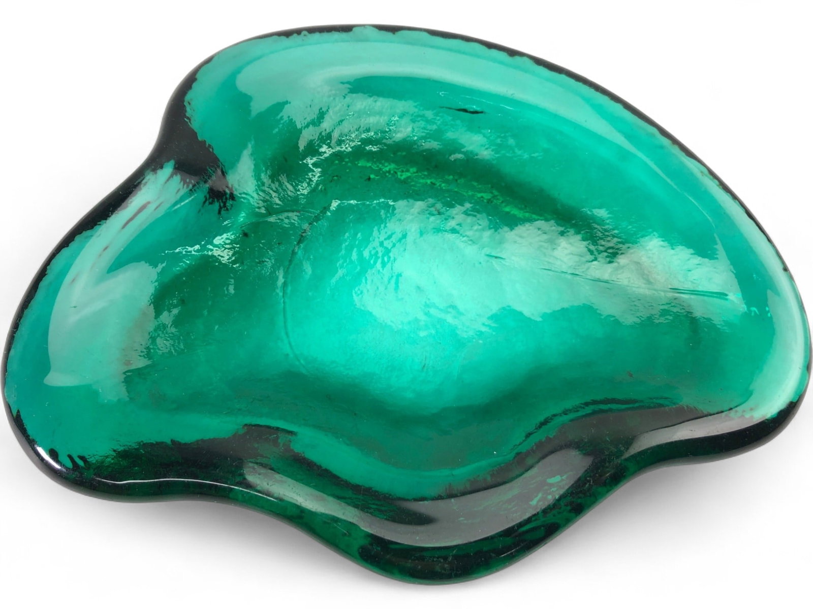 MCM Blenko Amoeba Free Form Teal Glass Bowl: Mid-Century Modern free-form "amoeba" style art glass bowl, attributed to Blenko. Hand-blown teal glass with a heavy, organic shape and a smooth, polished finish. Features a thick rim and a slightly