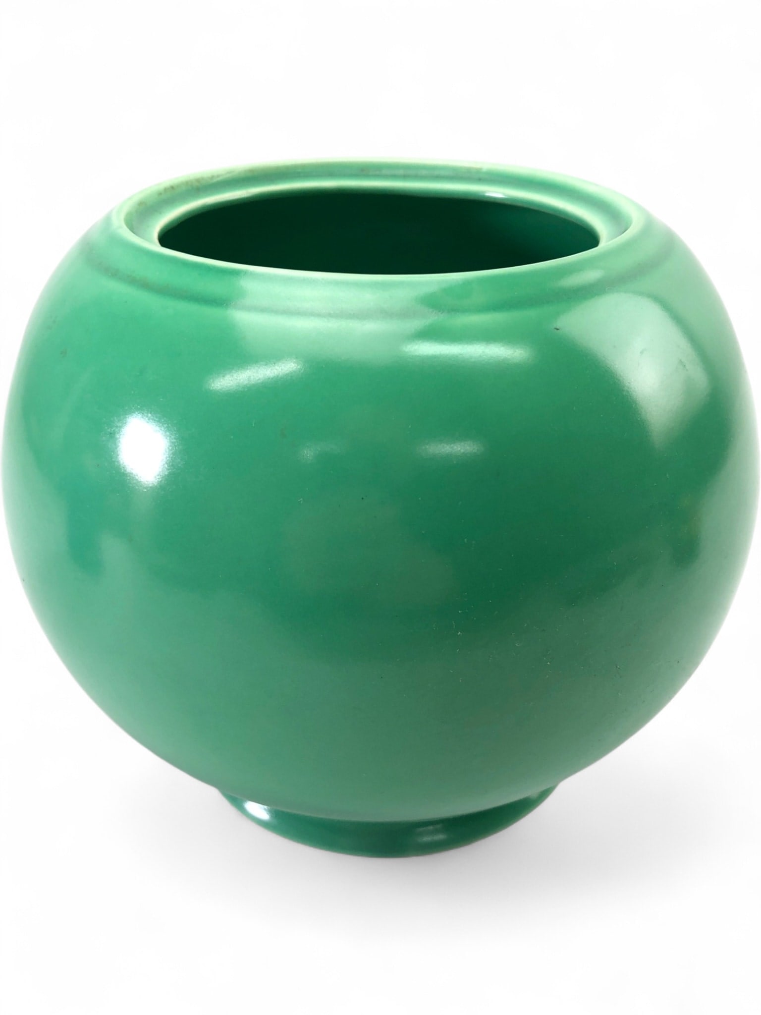 Rare Fiesta Kitchen Kraft Ceramic Ball Canister: Rare 1940s Fiesta Kitchen Kraft "cookie jar" ceramic ball canister in green. This earthenware piece features the characteristic concentric rings and a spherical body. Marked on the base with the "HLC 
