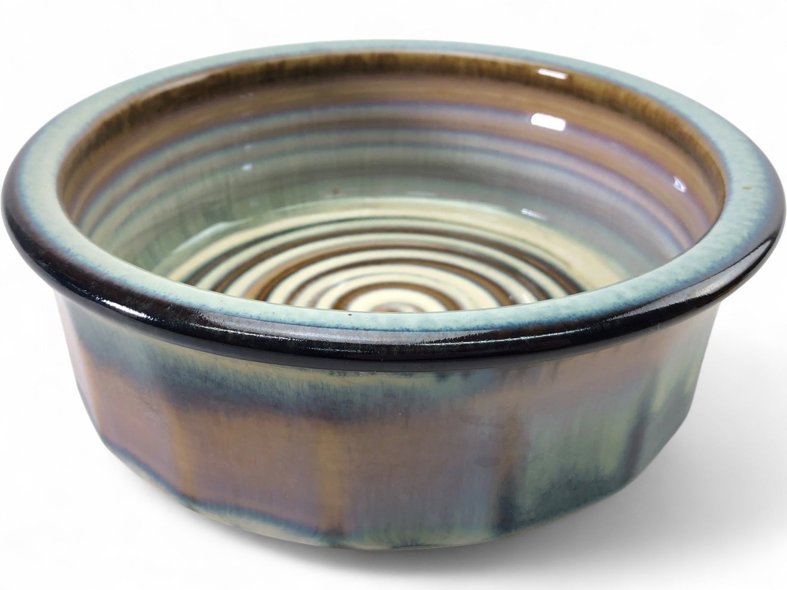 Bill Campbell Signed Studio Art Pottery Bowl: Studio art pottery bowl by Bill Campbell. This stoneware piece features a vibrant blue and green drip glaze on the exterior and a distinctive spiral swirl pattern in the interior. The underside is sig