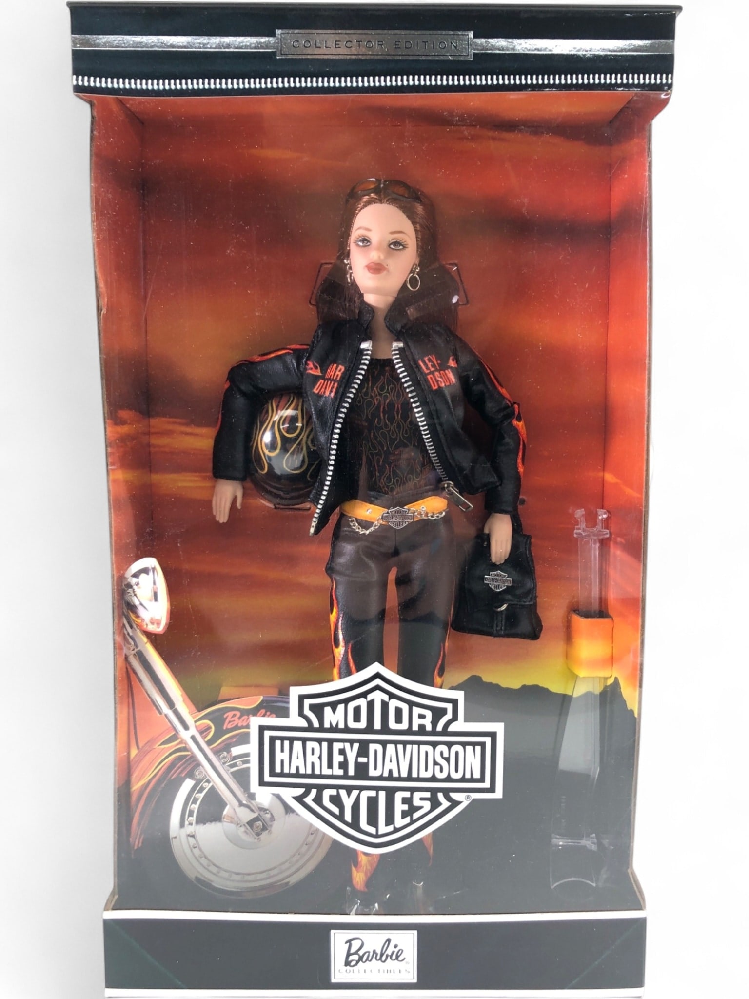 NIB Harley-Davidson Barbie Doll Collector Edition: NRFB Harley-Davidson Barbie Doll, Collector Edition No. 29207. Features Barbie in a black leatherette flame-print jacket with working zipper, matching pants, and shirt. Includes helmet, sunglasses, ba