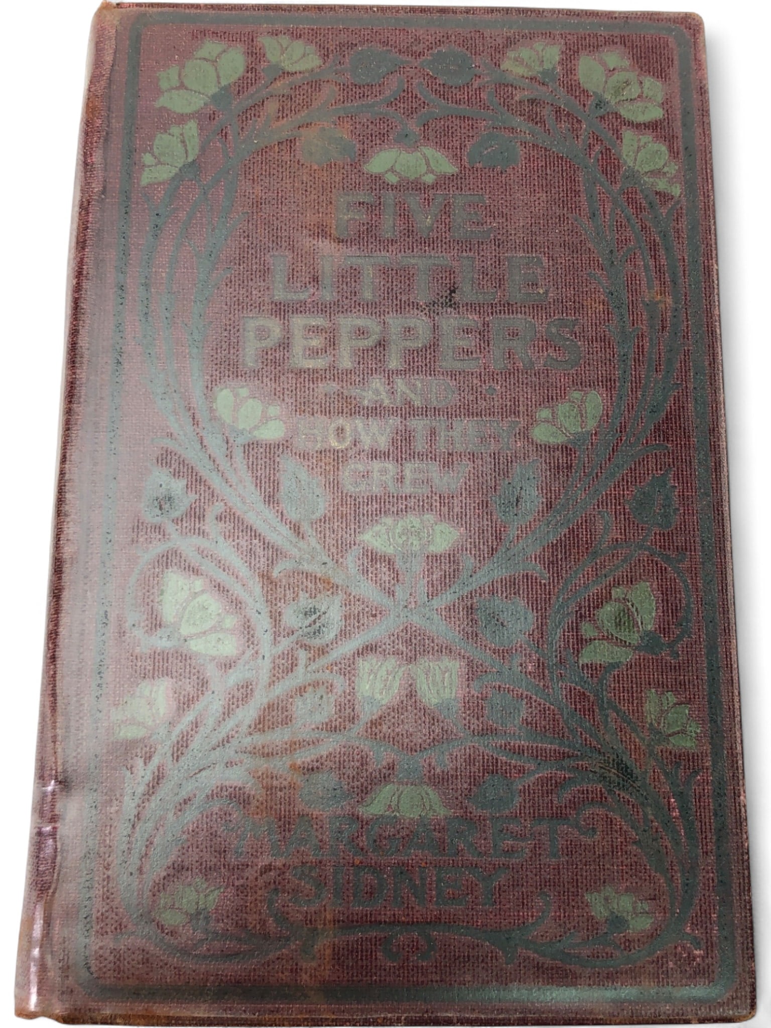 1881 Margaret Sidney Five Little Peppers Hardcover: Five Little Peppers and How They Grew by Margaret Sidney. Published by Lothrop Publishing Company, Boston. Hardcover with decorative cloth binding featuring a floral Art Nouveau style motif.