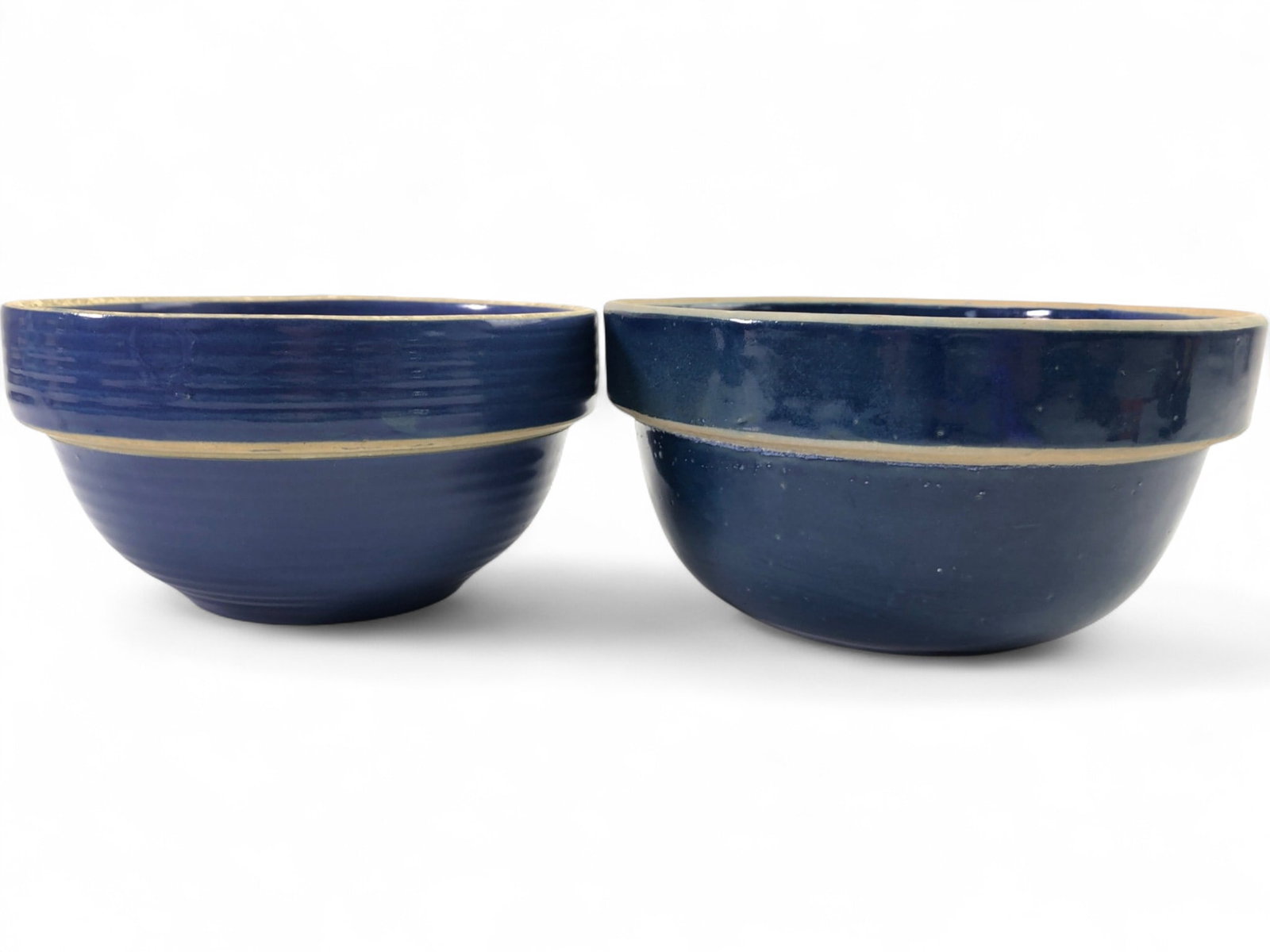 VTG Clay City Pottery Blue Stoneware Mixing Bowls: VTG Clay City Pottery blue stoneware mixing bowls, a pair. One bowl features a ribbed exterior, the other is smooth. One bowl is marked "CLAY CITY CENTENNIAL 1873 1973 L. GRIFFITH MGR CLAY CITY