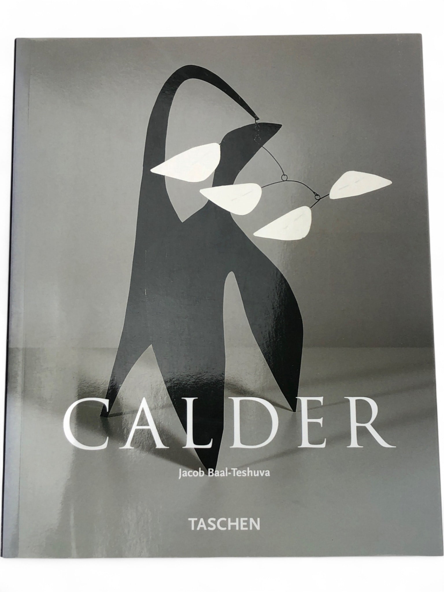 Alexander Calder: Jacob Baal-Teshuva TASCHEN Book: Soft cover art book, 'Alexander Calder' by Jacob Baal-Teshuva, published by TASCHEN. This comprehensive volume features extensive illustrations of Calder's iconic mobiles, stabiles, and sculptures,
