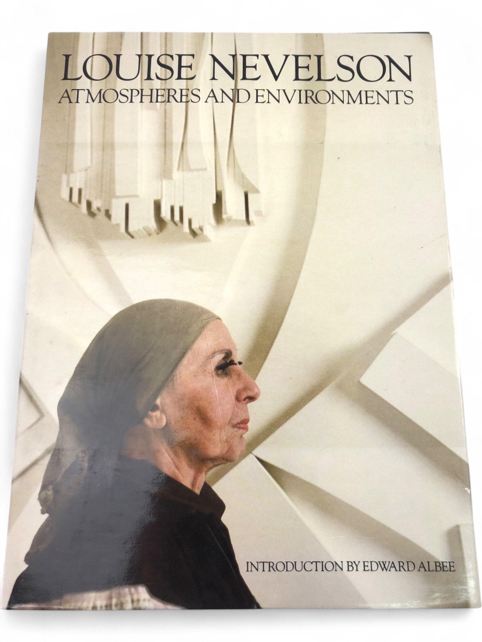 Louise Nevelson: Atmospheres & Environments: 1980 first edition, first printing hardcover book with dust jacket, 'Louise Nevelson: Atmospheres and Environments.' Published by Clarkson N. Potter & Whitney Museum of American Art. Features an intro