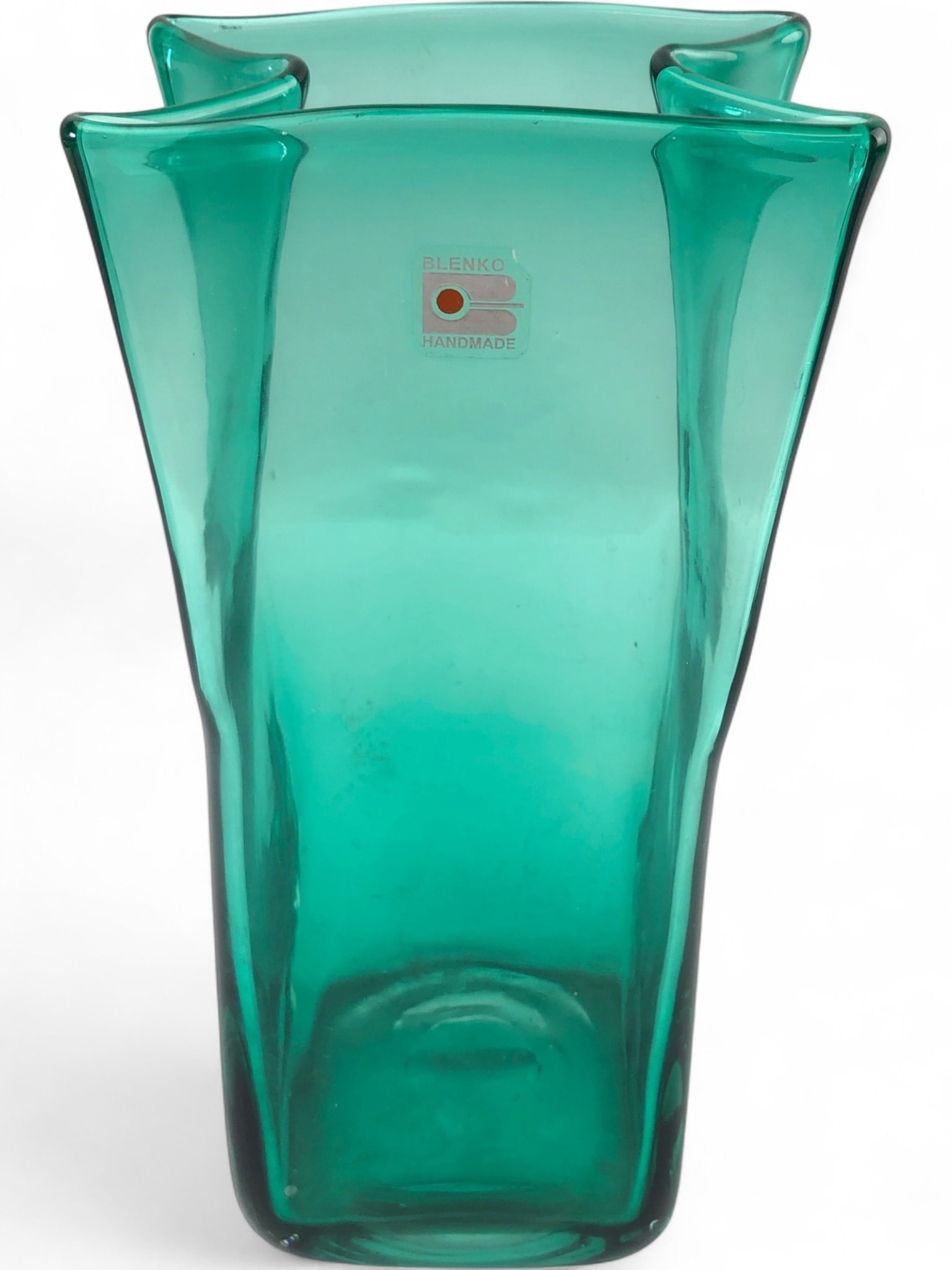MCM Blenko Hand Blown Art Glass Vase: MCM Blenko hand-blown art glass vase in a vibrant emerald green. Features a distinctive 'paper bag' form with a four-lobed, wavy rim and a pontil mark on the base. Retains original Blenko 'Handmade' l