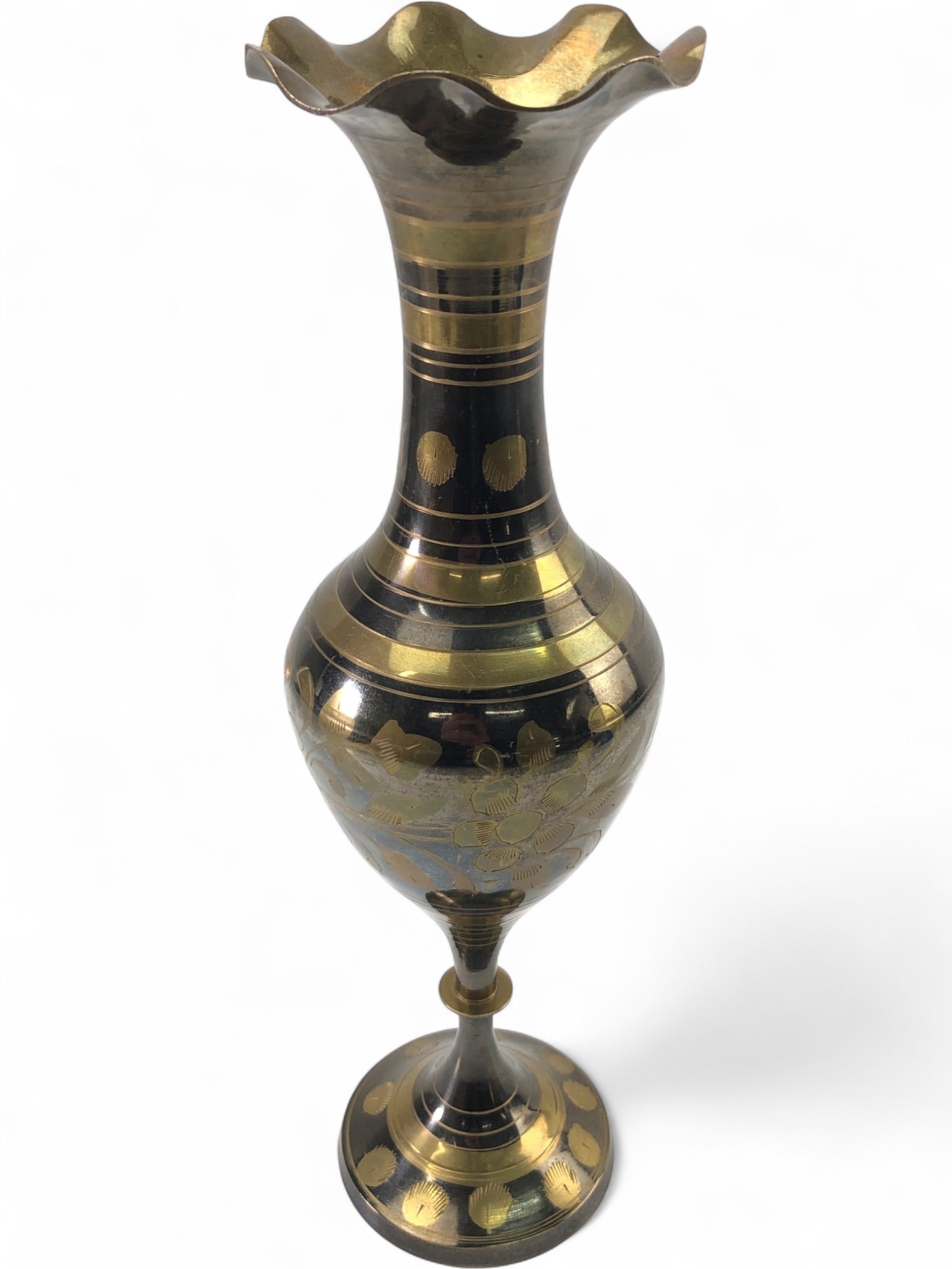 VTG Brass Vase, Black & Gold Floral Etching: VTG hand-crafted brass vase featuring black and gold floral etching and a distinctive fluted rim. This goblet-style vase has a bulbous body and a flared base, showcasing traditional decorative pattern