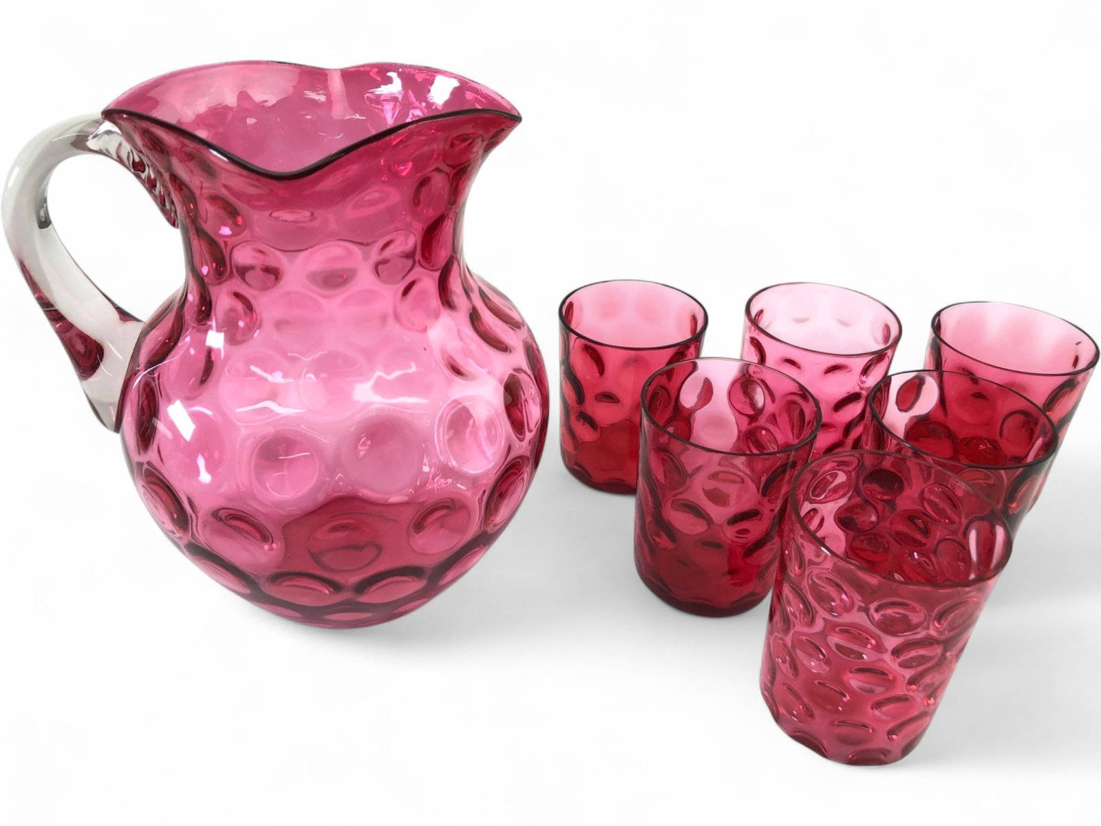 Rare Hobbs Brockunier Cranberry Opalescent Pitcher & Glasses: Rare 19th century Victorian cranberry opalescent glass water set by Hobbs, Brockunier & Co. in the Reverse Thumbprint (Inverted Thumbprint) pattern. Set includes one hand-blown pitcher with a clear ap