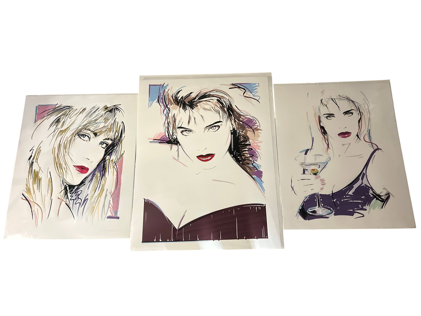 Dennis Mukai Limited Edition Serigraph Prints, Set of 3: Set of three limited edition serigraph prints by Dennis Mukai. Each print features a stylized female portrait in the artist's signature 1980s/90s aesthetic. Includes one print numbered 196/275 (1991),