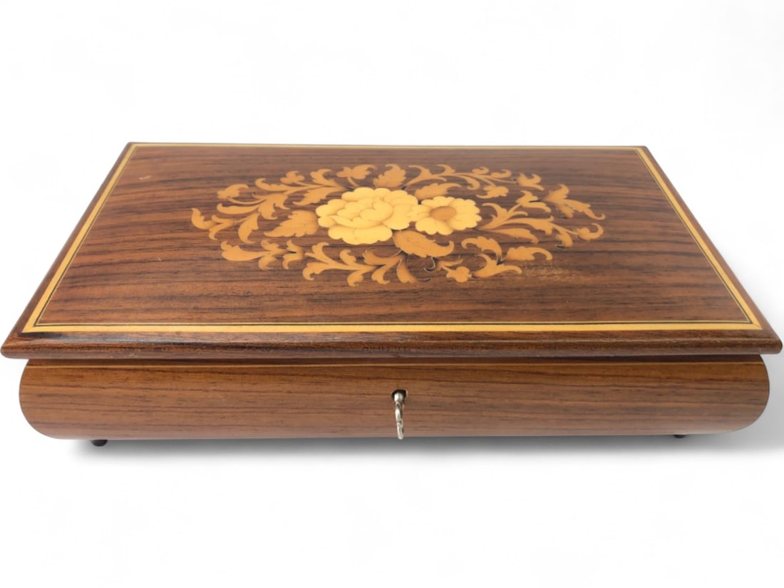 VTG Sorrento Italy Marquetry Jewelry Music Box: VTG Sorrento Italy marquetry jewelry music box. Features a wood inlay lid with a floral design, red velvet-lined interior with a mirror in the lid, and a divided compartment. Includes its original met