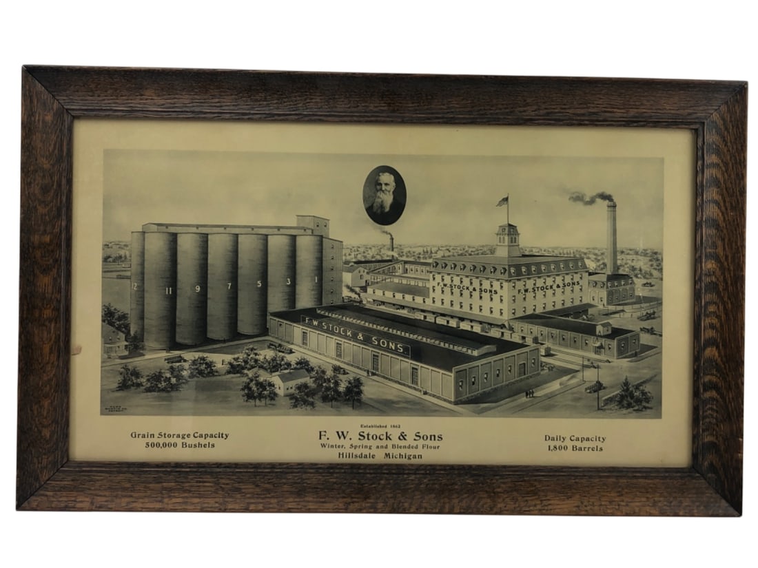 VTG F. W. Stock & Sons Hillsdale Michigan Print: Vintage lithograph print depicting the F. W. Stock & Sons flour mill in Hillsdale, Michigan. The artwork features an aerial view of the facility, including grain silos, factory buildings, and a