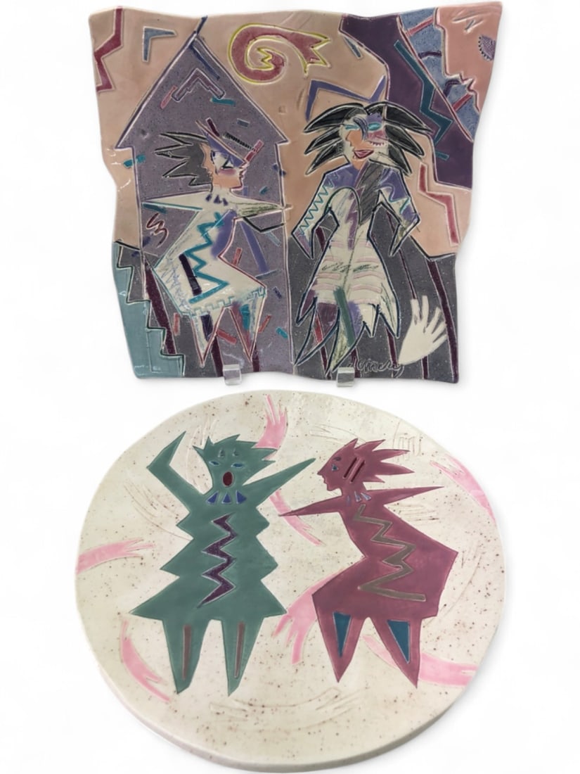 Barbara Demery Signed Handmade Pottery Plates: Set of two handmade earthenware pottery plates by Barbara Demery. Includes one square-form plate with wavy edges featuring a stylized figural scene, signed "Demery" on the front, and one circular